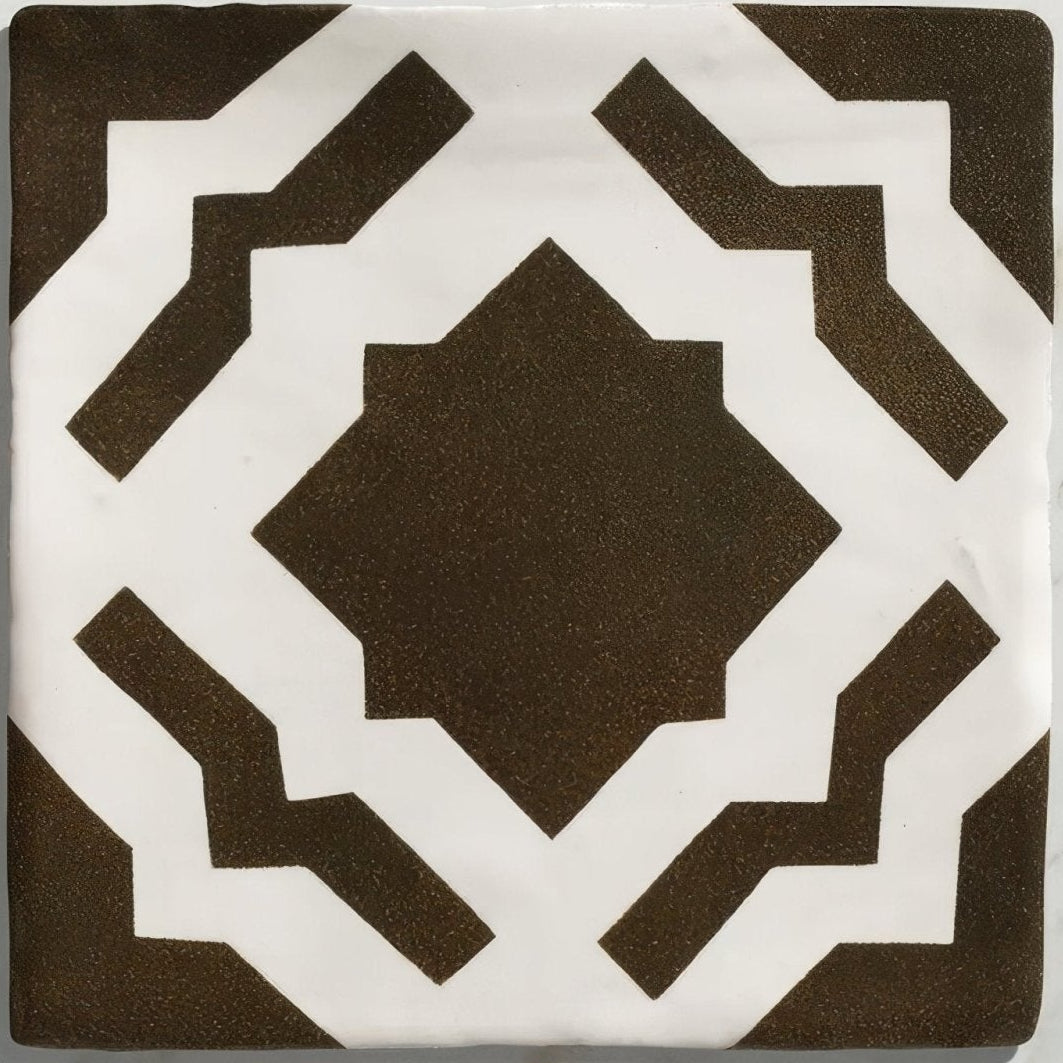 Brown and white geometric patterned ceramic tile with a matte finish from Studio Cassius Brown Ceramic collection