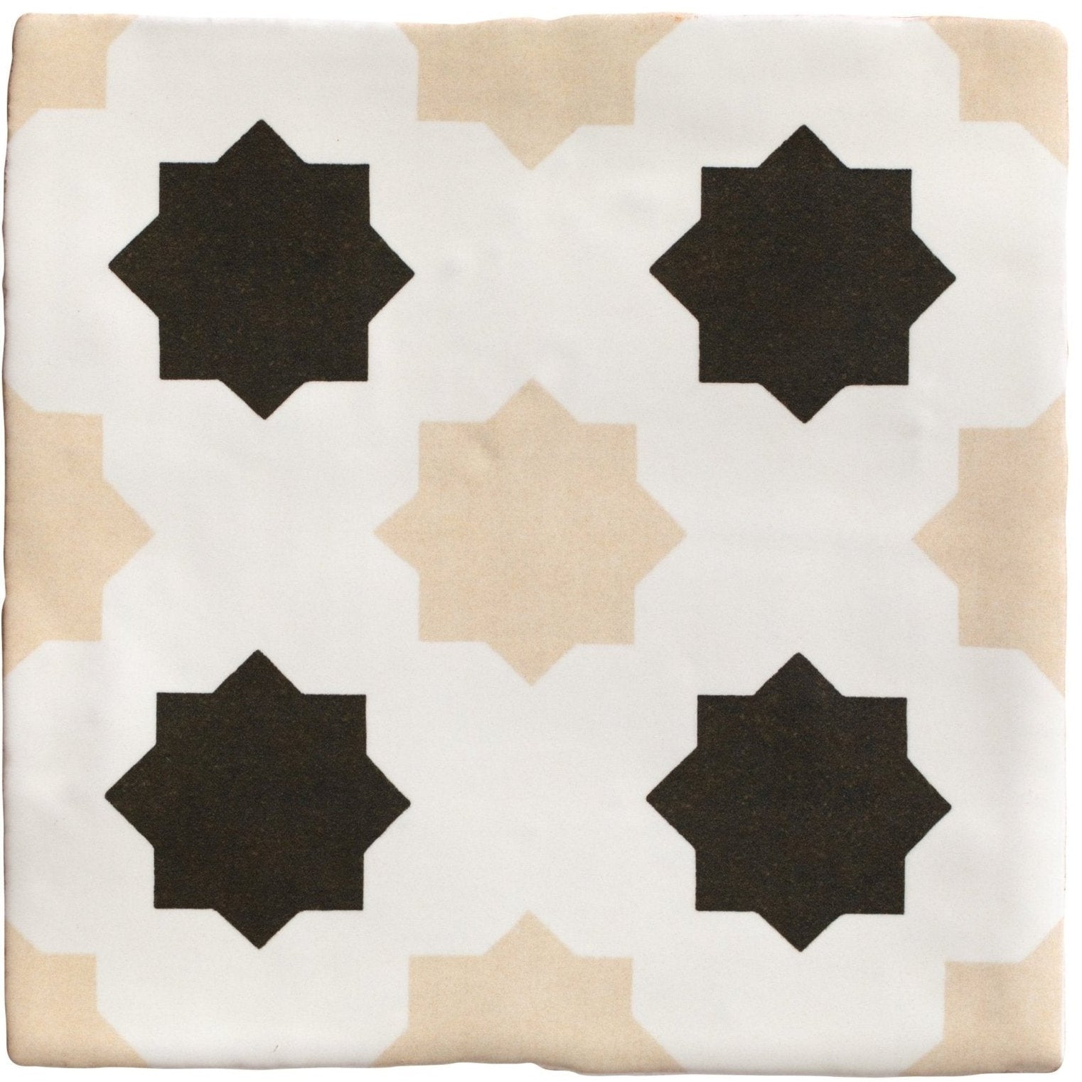 Square ceramic tile with a white beige and black geometric star pattern from studio cosmos sand ceramic collection