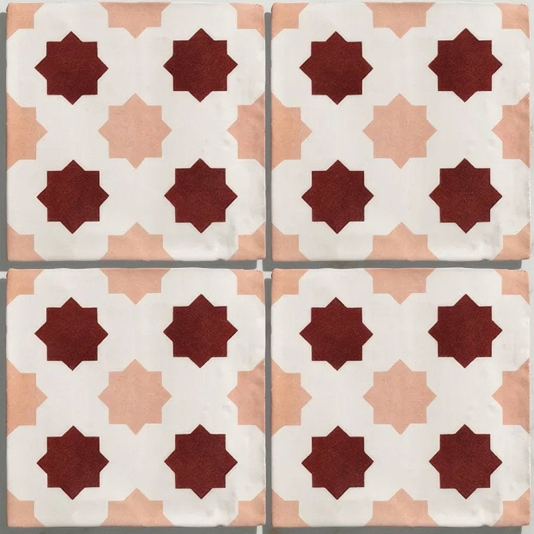 Studio cosmos zagora ceramic four square tiles with deep red and soft peach star geometric pattern on white background