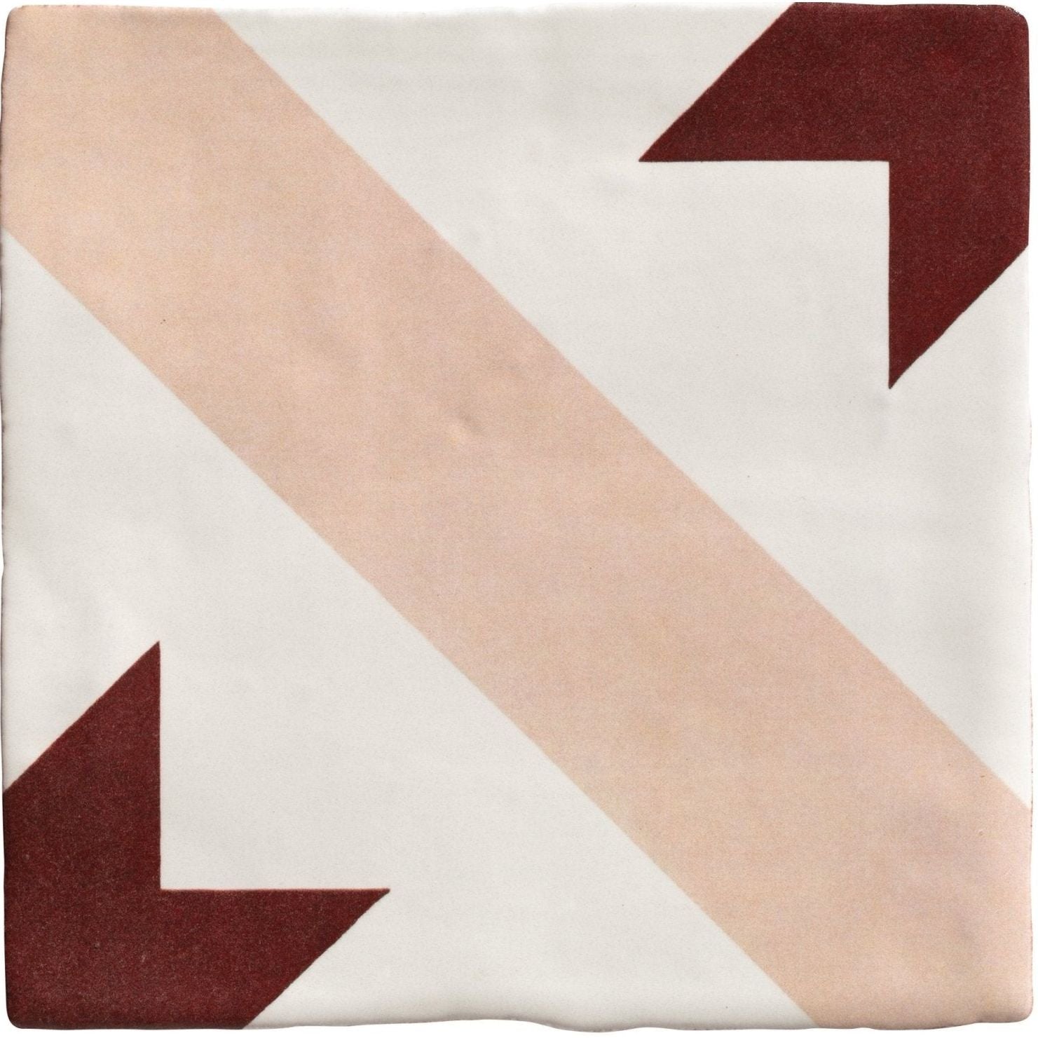 Studio Étoile red star ceramic square tile with white base, diagonal blush pink stripes, and maroon arrow corners