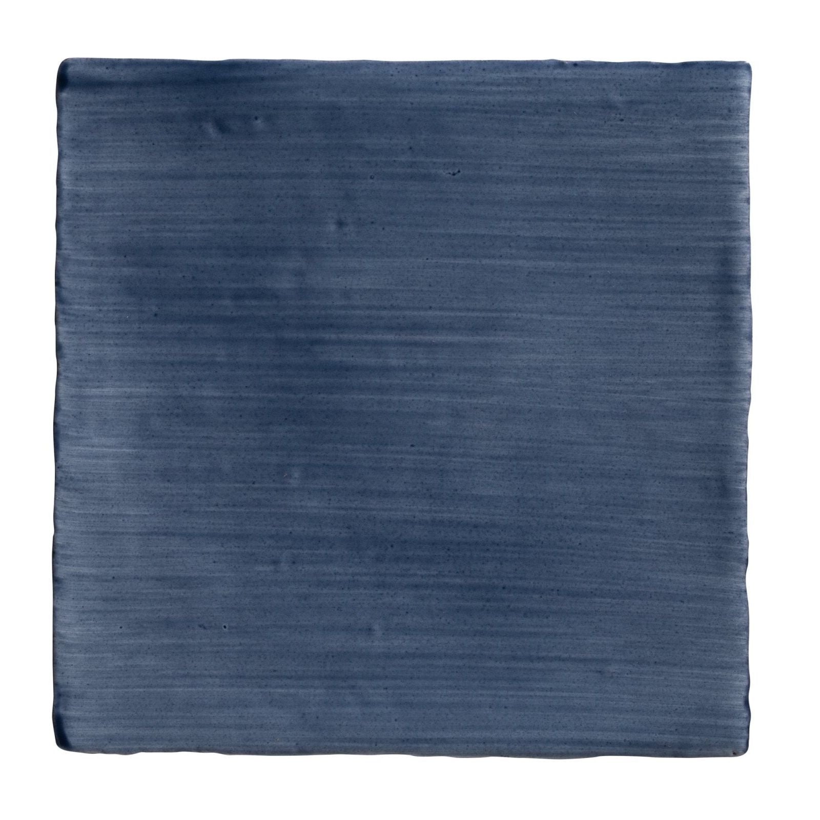 Studio Jamboree handpainted ceramic denim field tile with deep blue color brushed texture and handcrafted edges