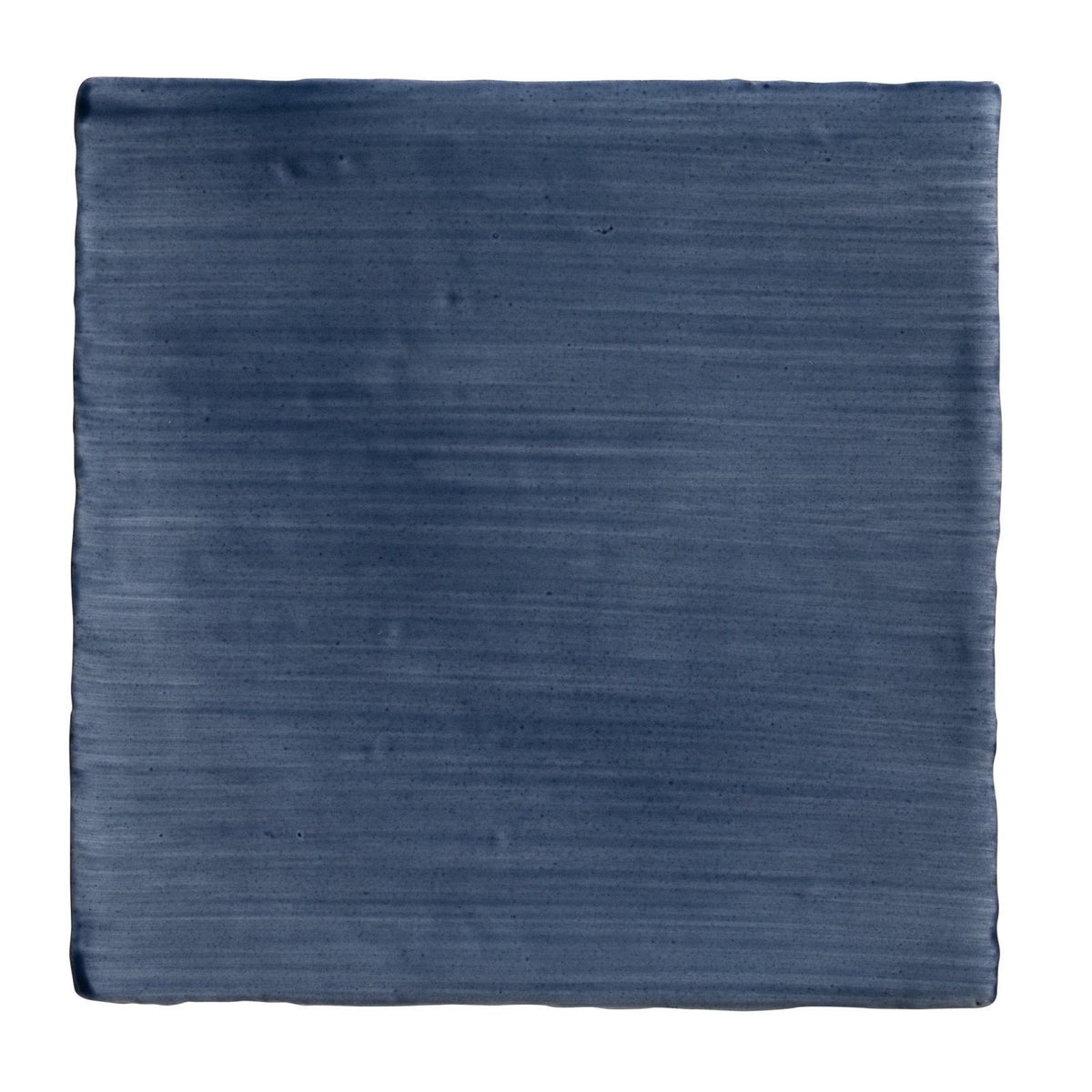 Studio Jamboree handpainted ceramic denim field tile with deep blue color brushed texture and handcrafted edges