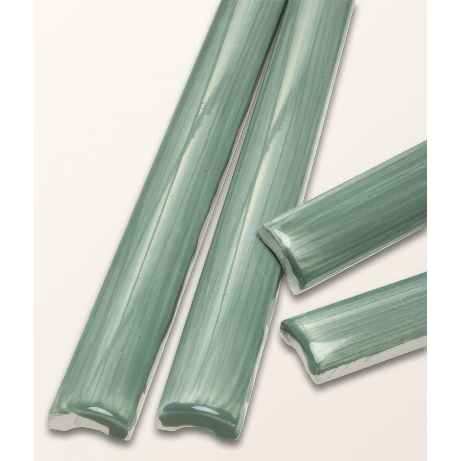 Studio jamboree handpainted ceramic thyme beading tiles in sleek matte teal with a subtle brushed texture and rounded edges