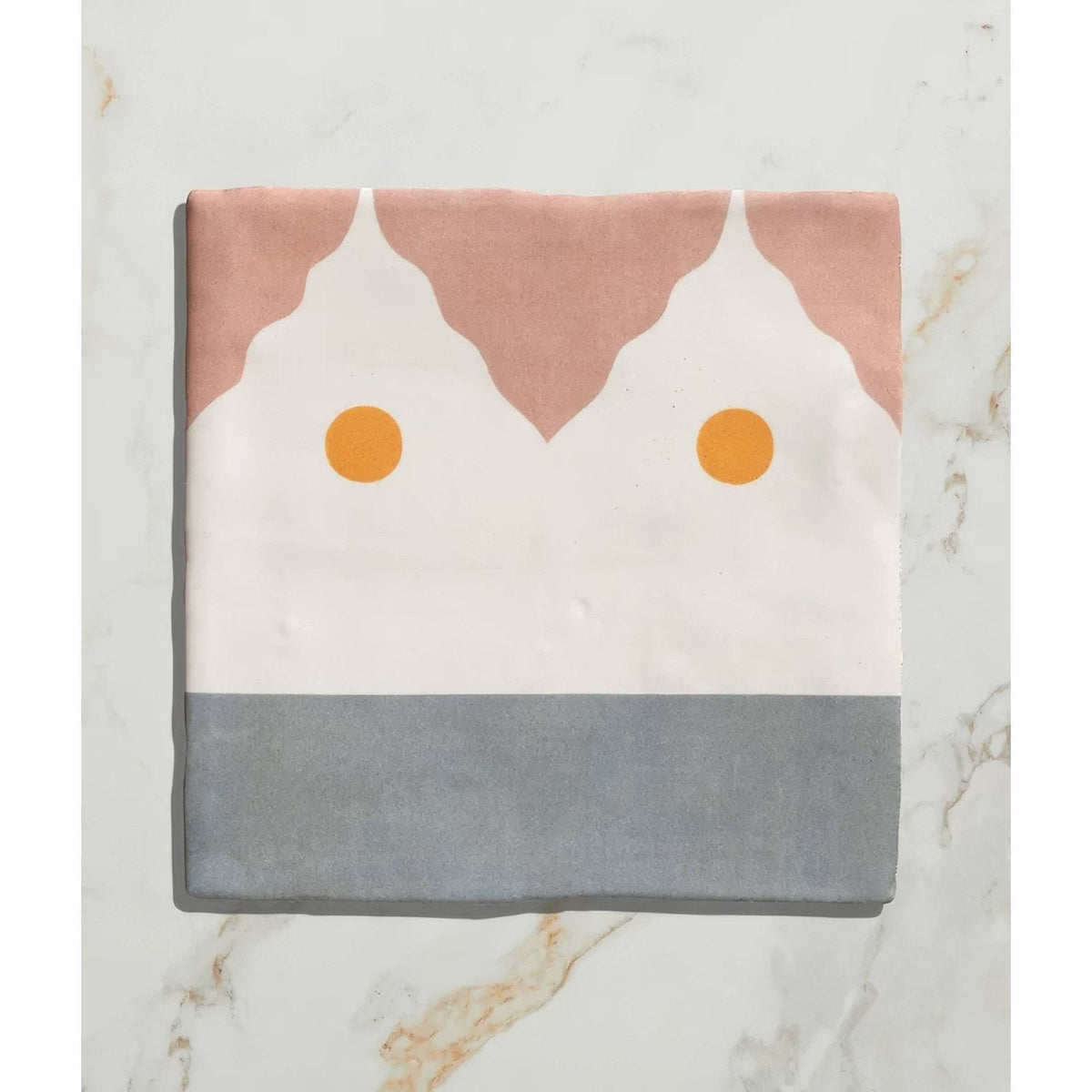 Studio Minaret yellow dot ceramic with soft pink white and gray geometric fabric square and two orange circular accents