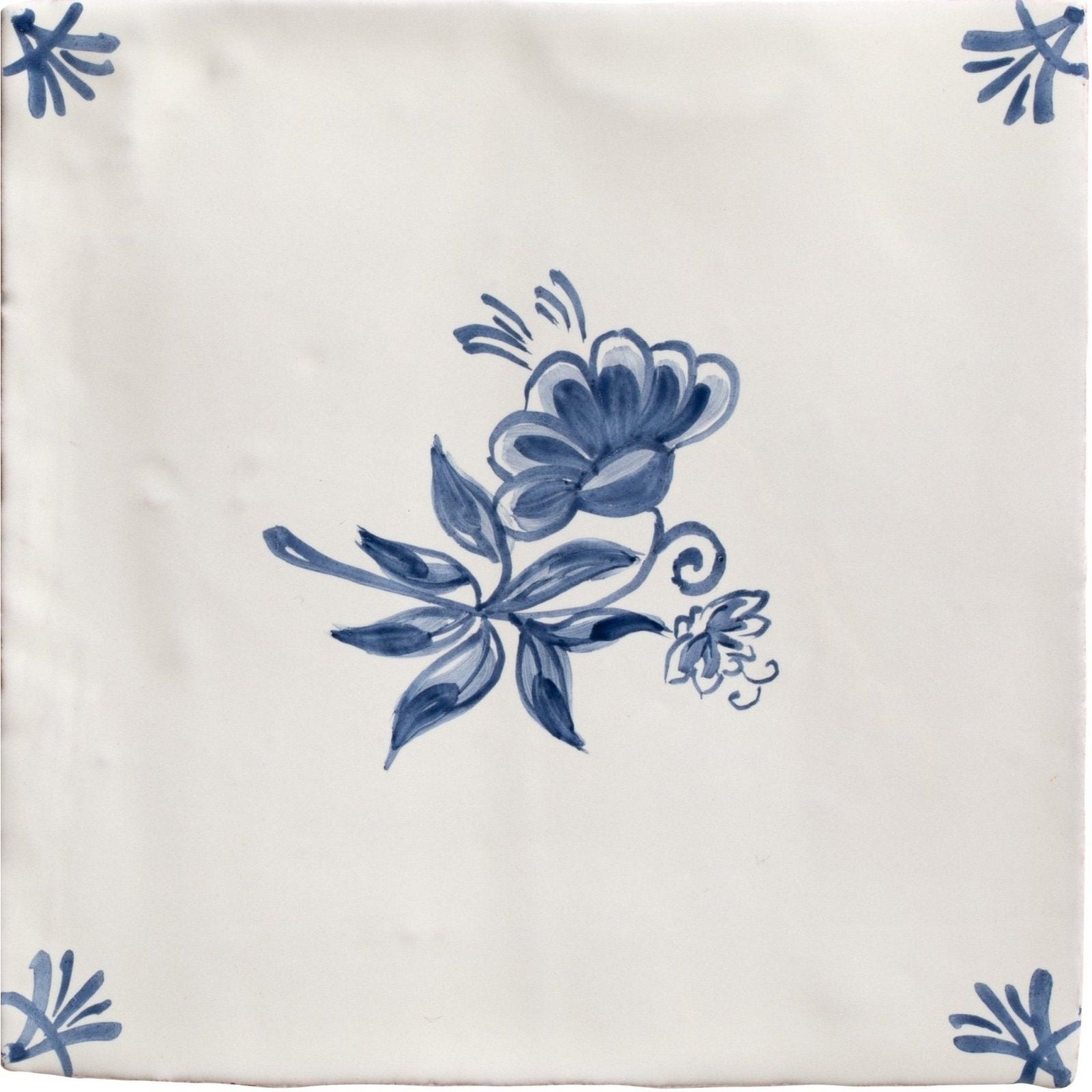 Studio Nonna’s Kitchen Classica ceramic tile cream colored with delicate blue floral and stylized leaf corner design