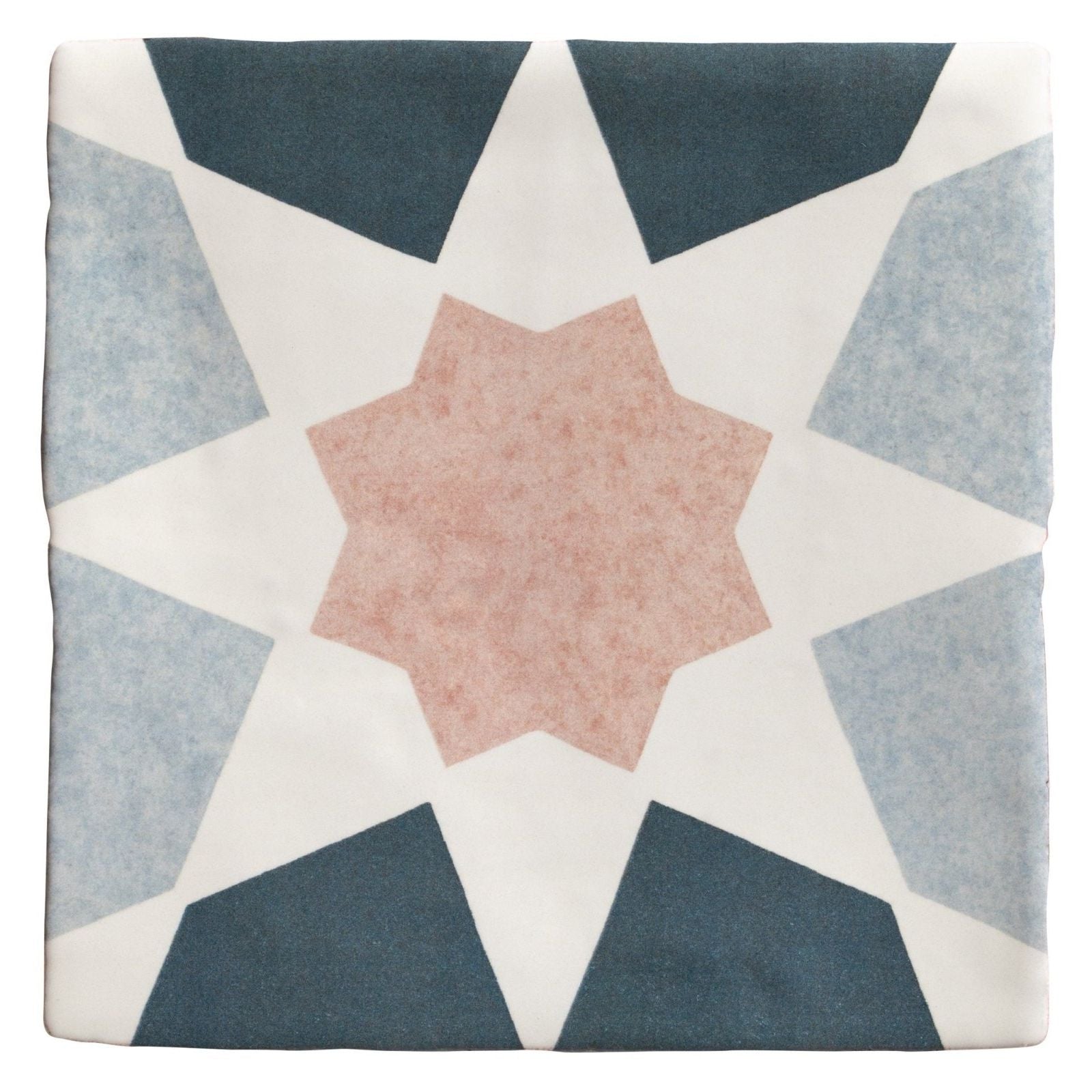 A square ceramic tile from Studio Souk pink star ceramic with a geometric star pattern in muted blue gray and soft pink tones