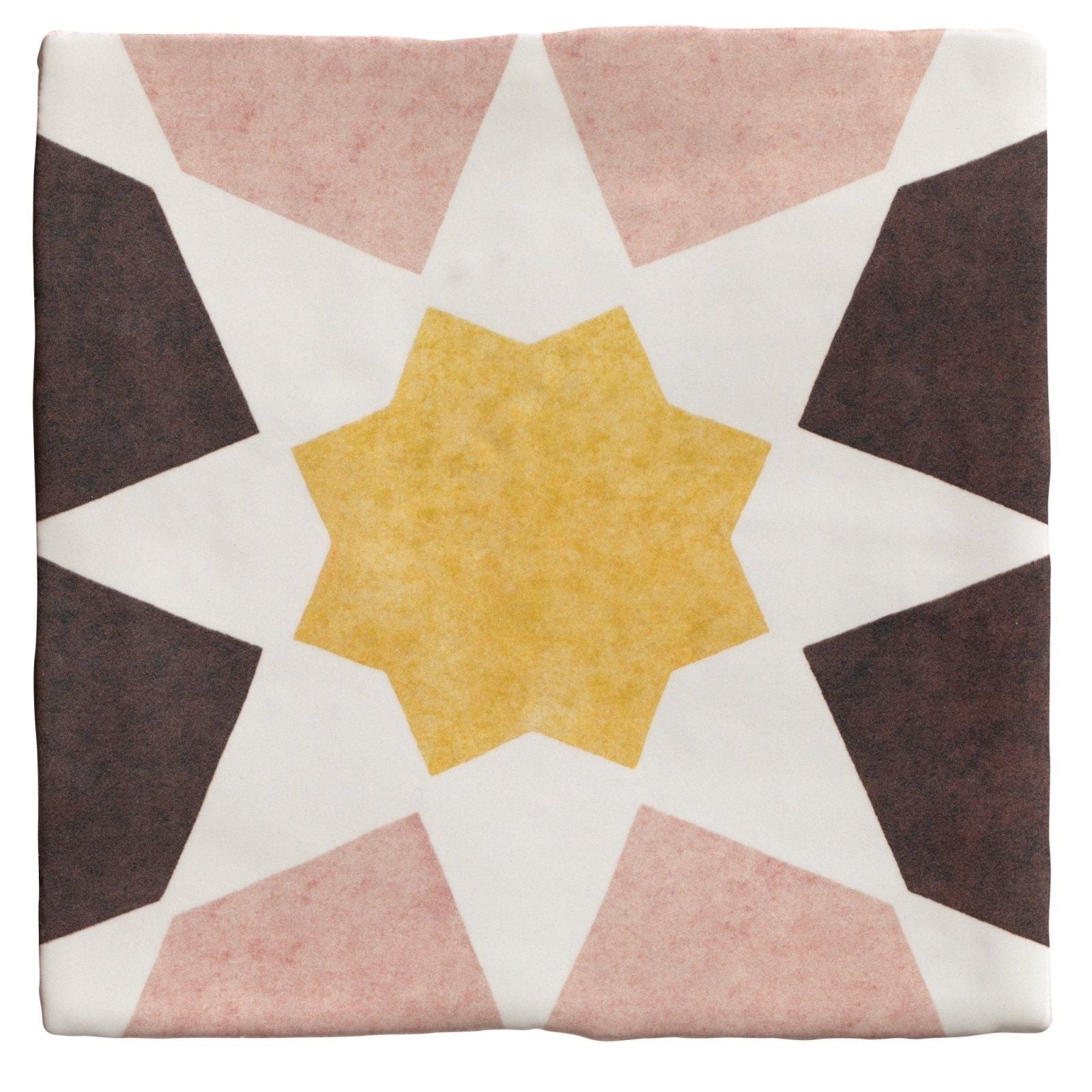 A square ceramic tile from Studio Souk featuring a geometric star pattern in muted pink dark brown and mustard yellow tones