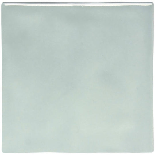 A square glossy light blue ceramic tile with a smooth slightly reflective surface from Sudbury crackle field tile collection