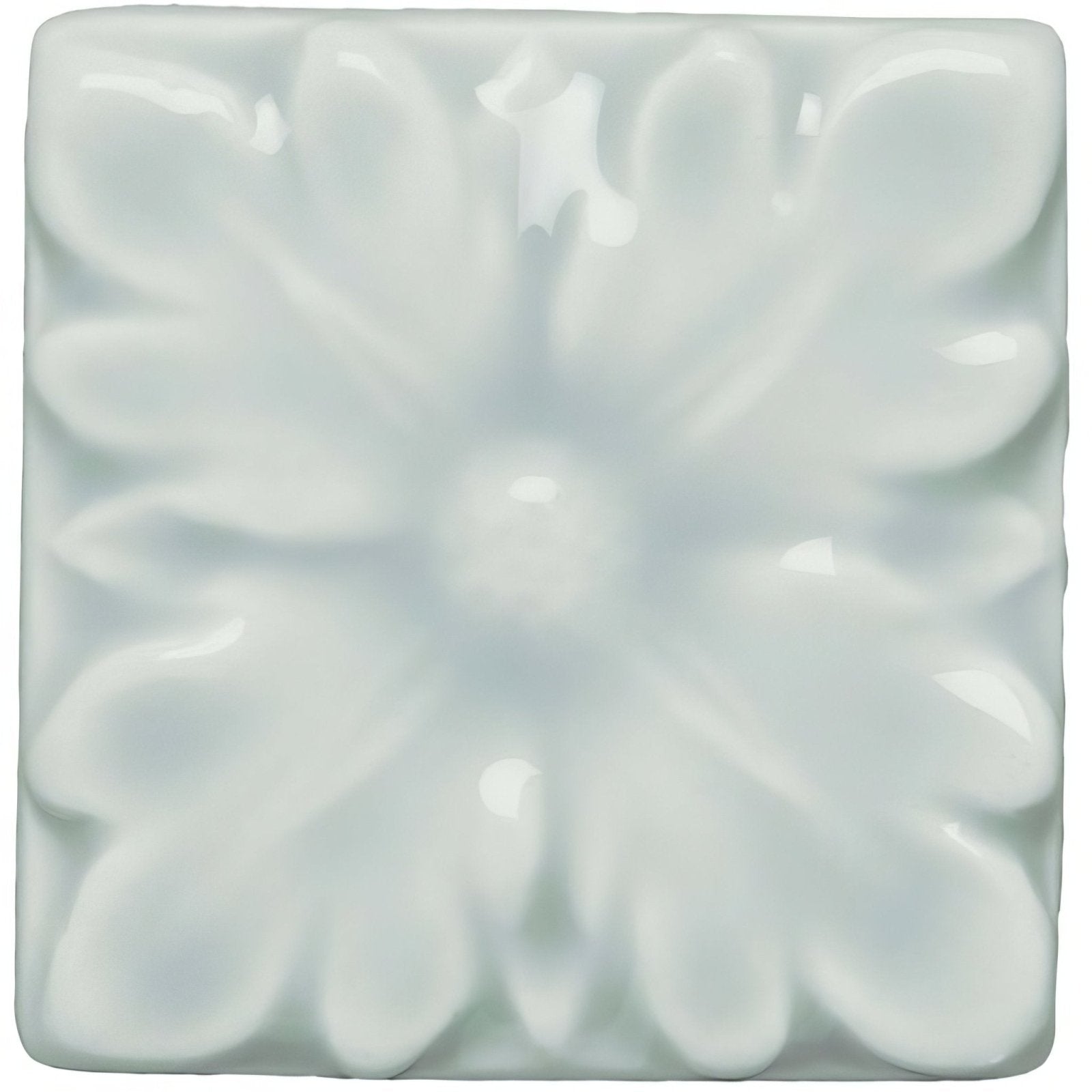 A square glossy white ceramic tile with a raised floral design from the Sudbury Knightsbridge collection