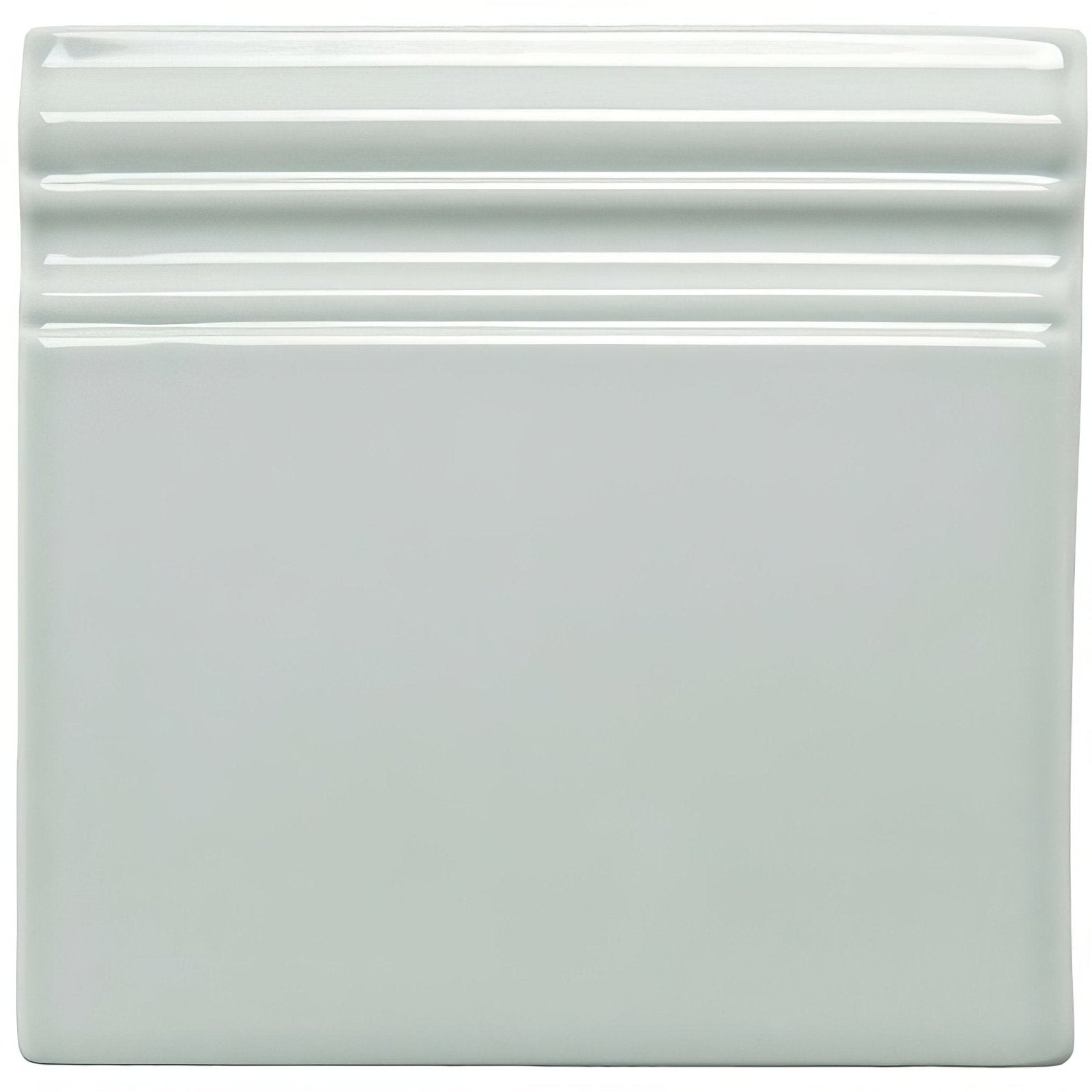 A square glossy light green ceramic sudbury skirting tile with three horizontal ridges along the top edge