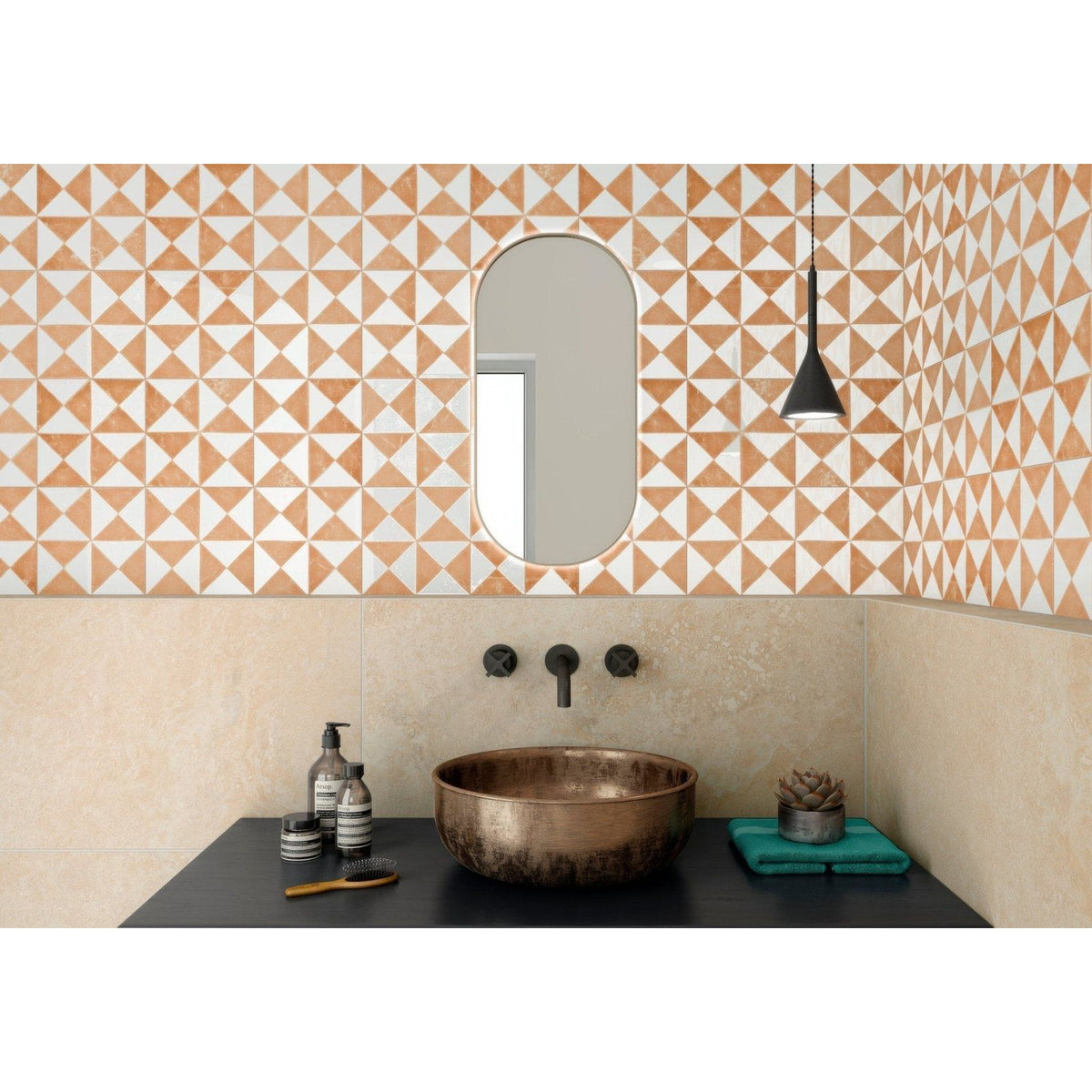 Bronze bowl sink in sunset orange with a matte slightly tarnished finish and rounded edges for bathroom use