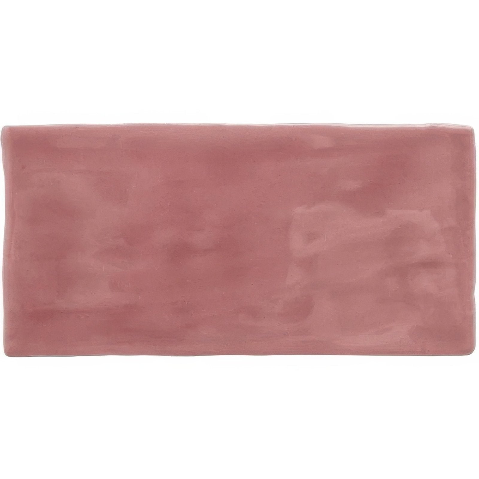 Tayberry brick tile is a rectangular pink ceramic tile with a matte finish and subtle textured surface
