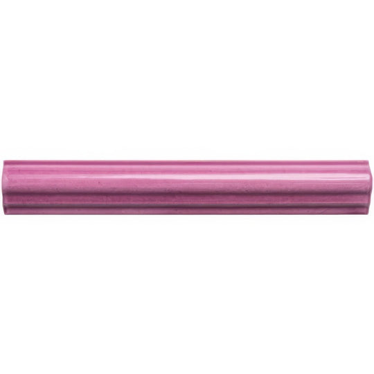 A sleek glossy pink ceramic Tayberry ogee moulding tile with subtle ribbed texture and rounded edges