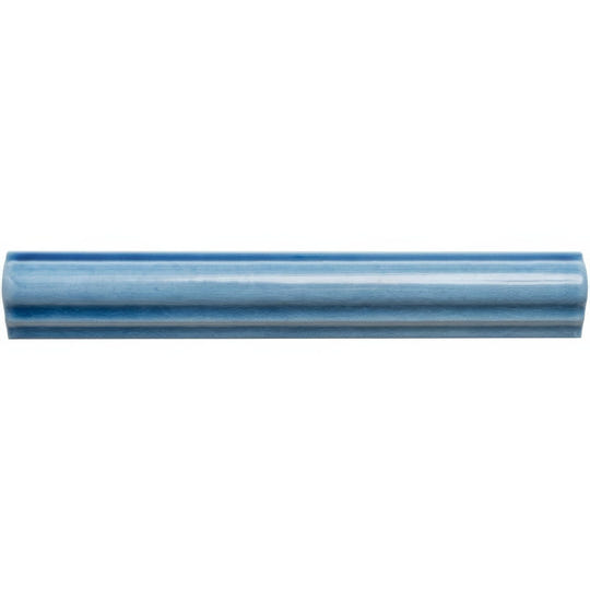A sleek glossy blue ceramic ogee moulding teal tile with subtle gradient and elegant ridged design