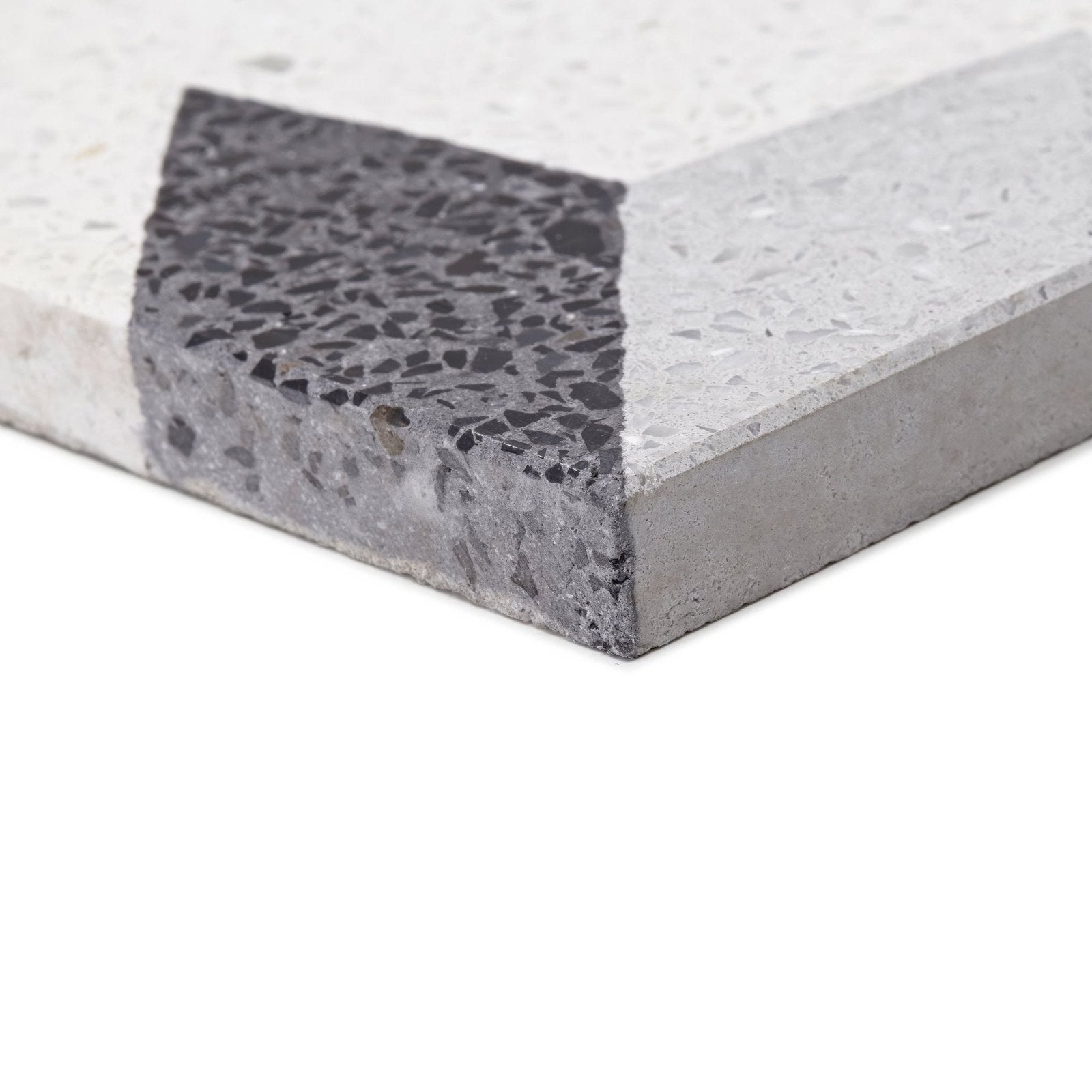 Gray terrazzo tile terrazzo crovato with speckled surface and contrasting dark aggregate in the corner