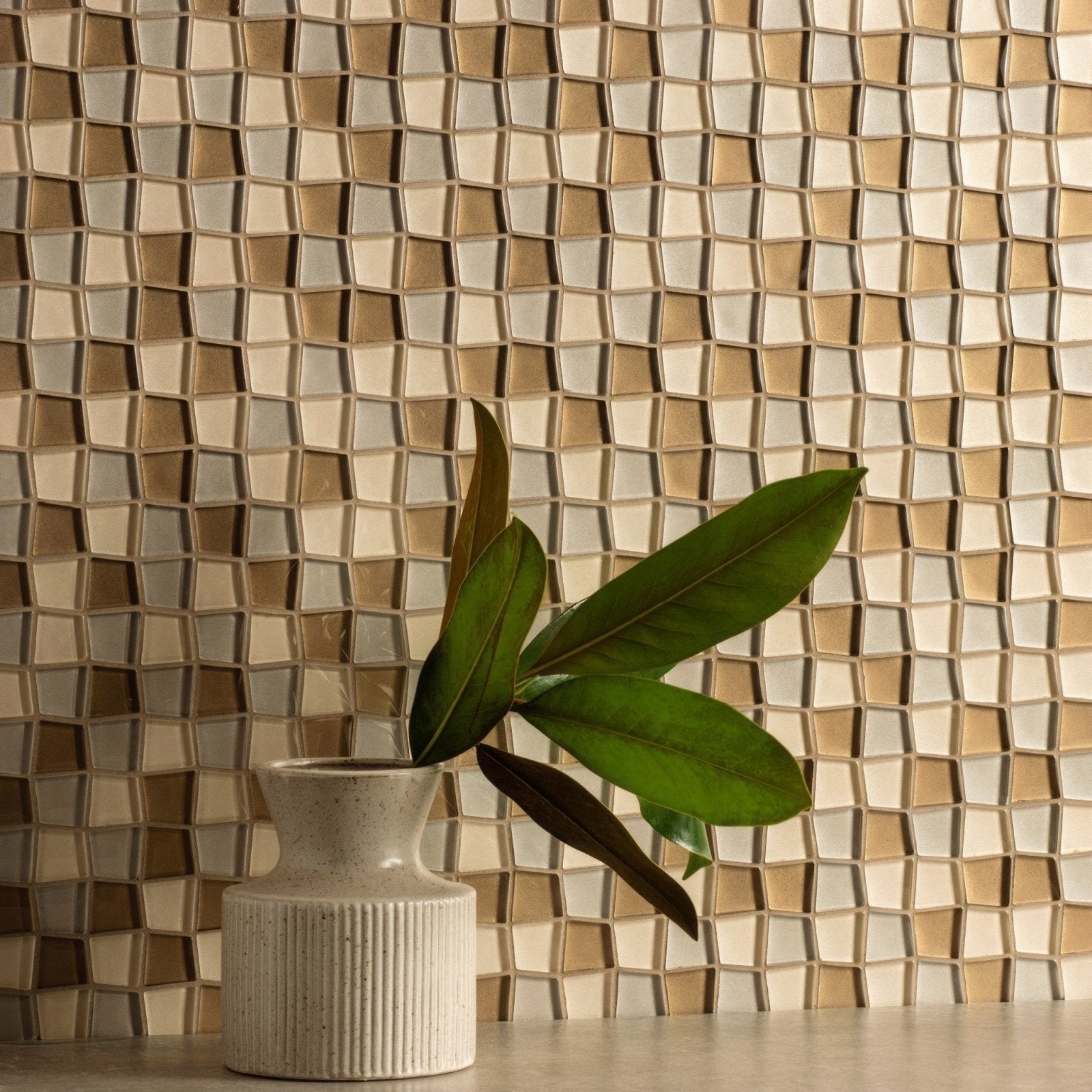 Theia Mixed Glass Mosaic blue and gold glass mosaic with a beige ridged vase
