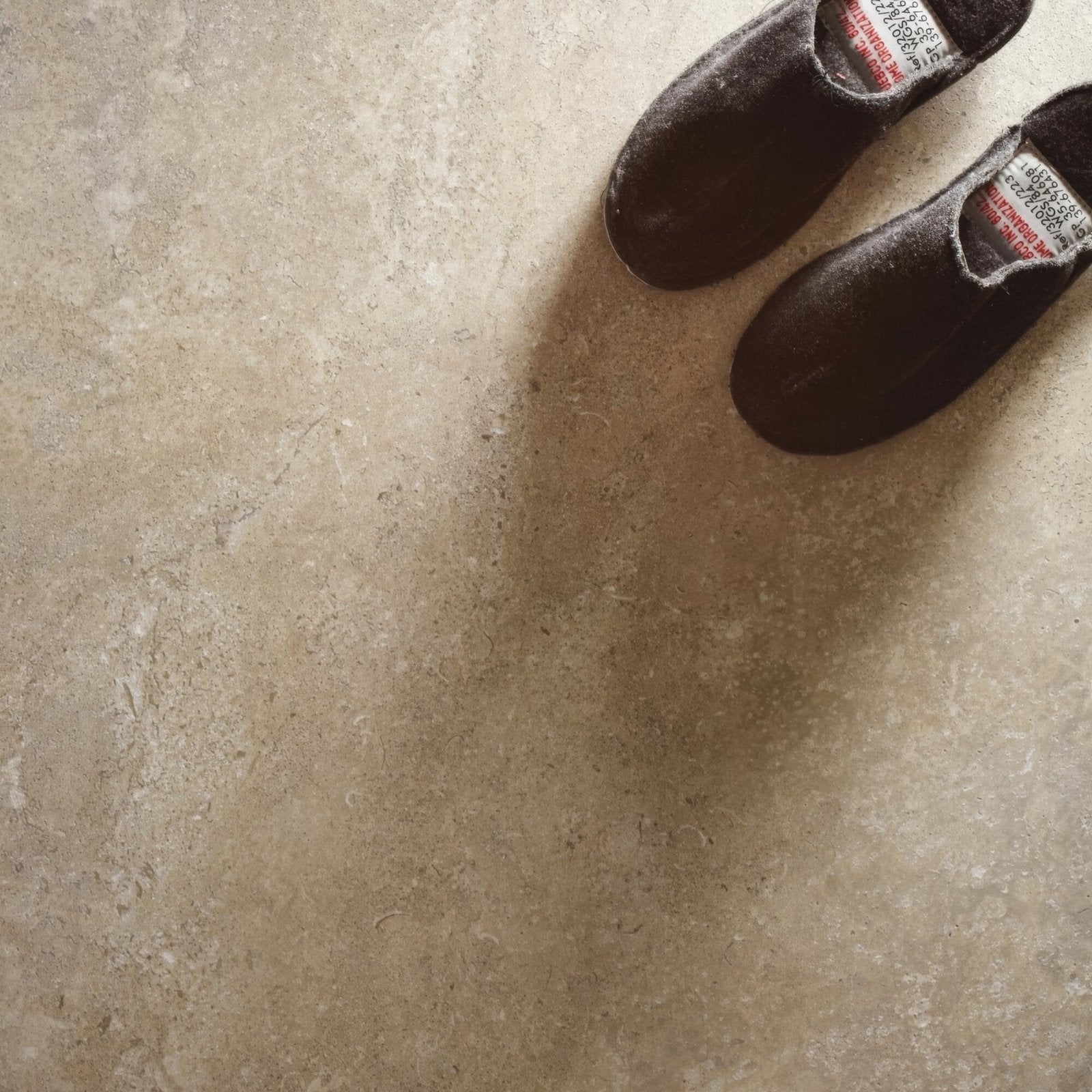 Dark brown suede slip-on tibur desert shoes with white and red label tags inside