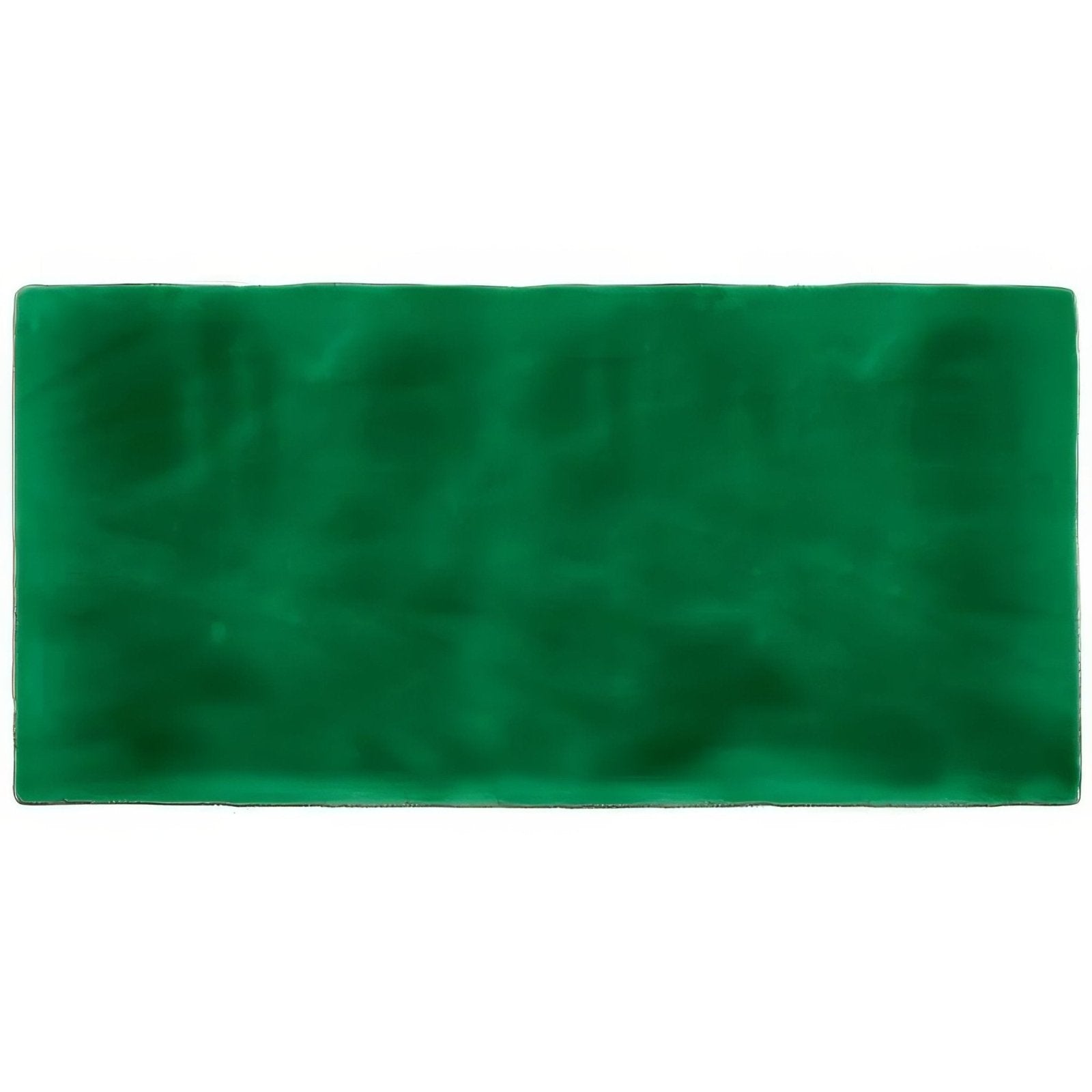 A rectangular deep green velvet tourmaline brick tile mat with soft plush texture and slightly uneven edges