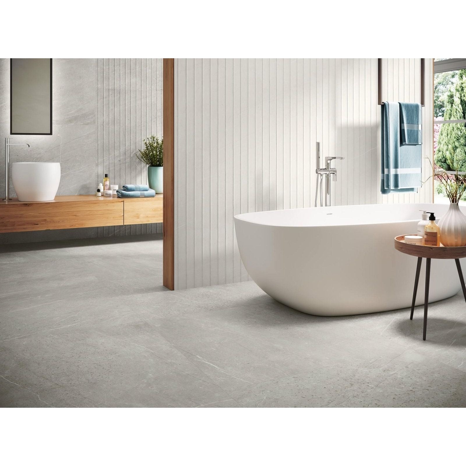 Trevi 1817 Silver Matt grey stone-effect tiles with a freestanding bathtub