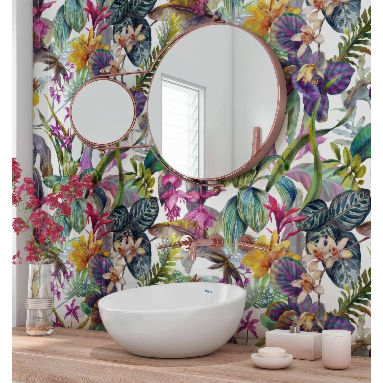 Round copper-framed mirror with a smaller circular mirror beside it on a tropical floral dream shower wall panel