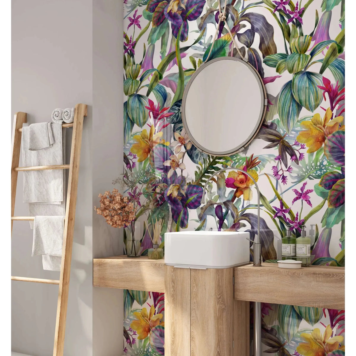 Round mirror with silver frame hanging above sink in tropical floral dream shower wall panel bathroom setting