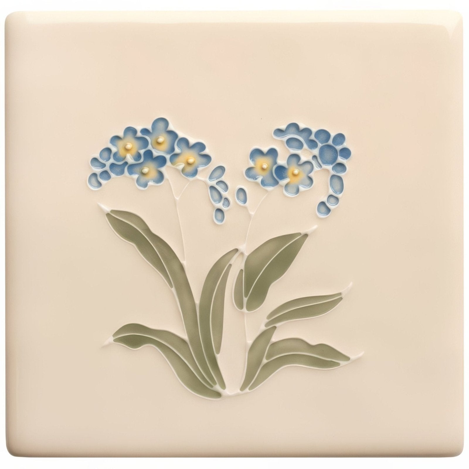 Cream-colored ceramic tile from tubelined floral collection featuring raised blue forget-me-not flowers with yellow centers