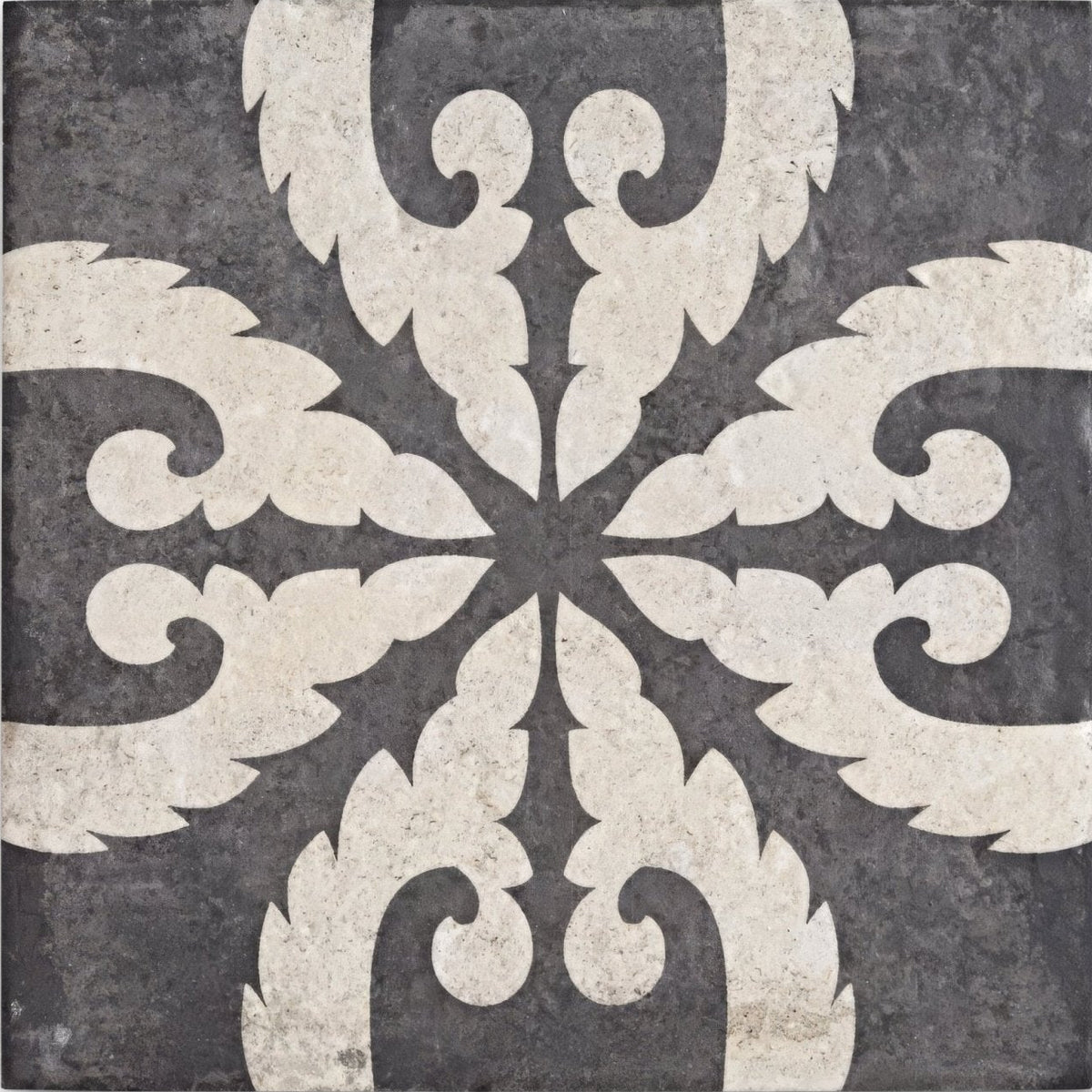 Urban velasco patterned porcelain tile featuring dark gray stone with symmetrical cream ornamental swirl leaf motifs