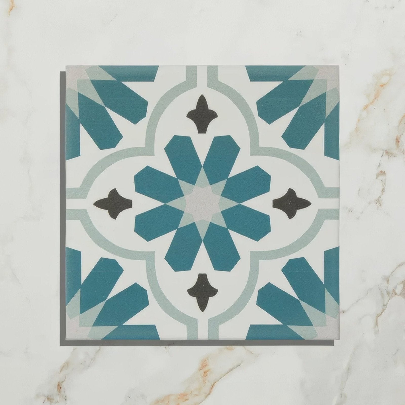 Vacation porcelain cordoba tile with teal and white geometric pattern and black accents for stylish flooring