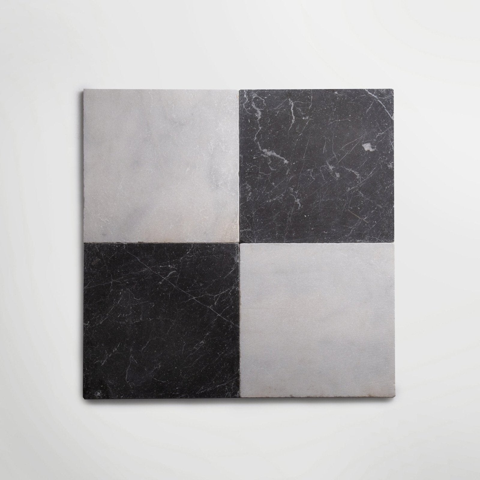 Venetian black 20 x 20cm black and white marble tiles arranged in a four-square checkerboard pattern