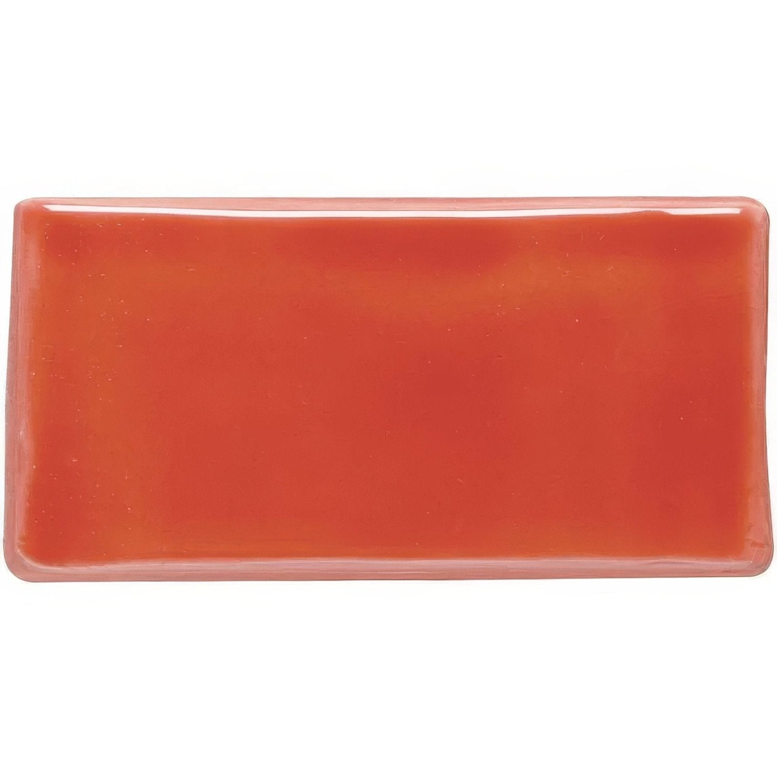 A glossy coral-colored rectangular ceramic vermillion half tile with rounded edges for wall or backsplash use