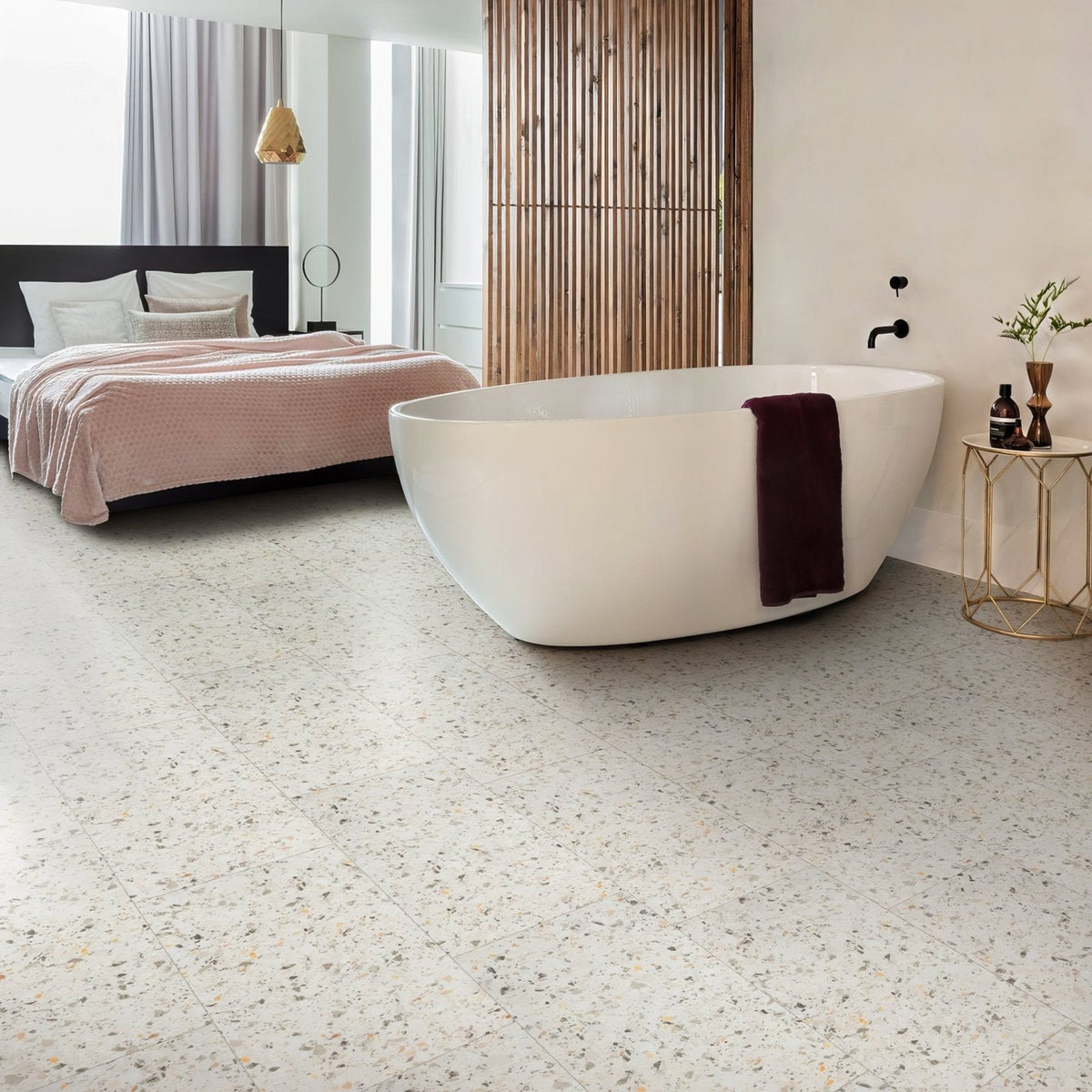 Modern freestanding bathtub with smooth glossy white vinyl finish next to Verona F523 terrazzo small vinyl tiles