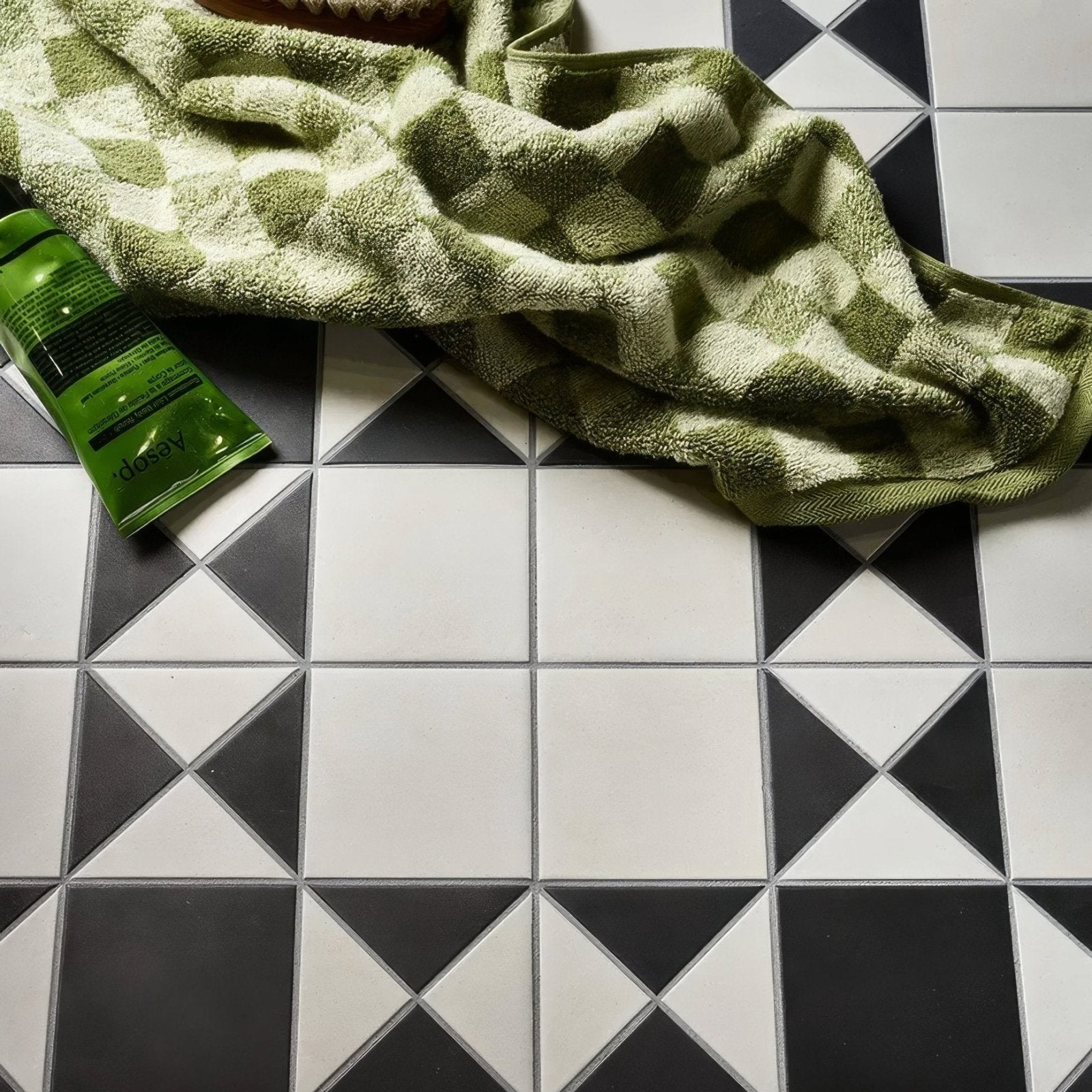 Victorian Style Porcelain Finchley Pattern Cotton White black and white geometric tiles with an olive green towel