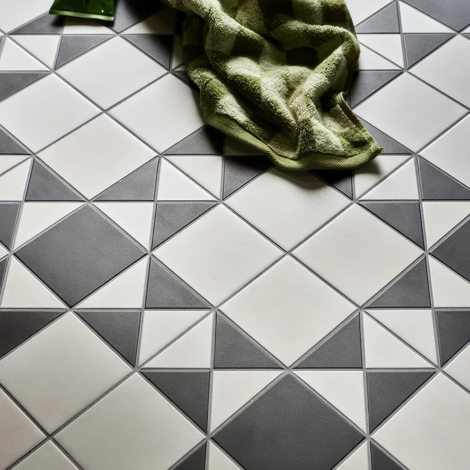 Victorian style porcelain tile floor in cotton white with geometric dark gray diamond pattern finchley design
