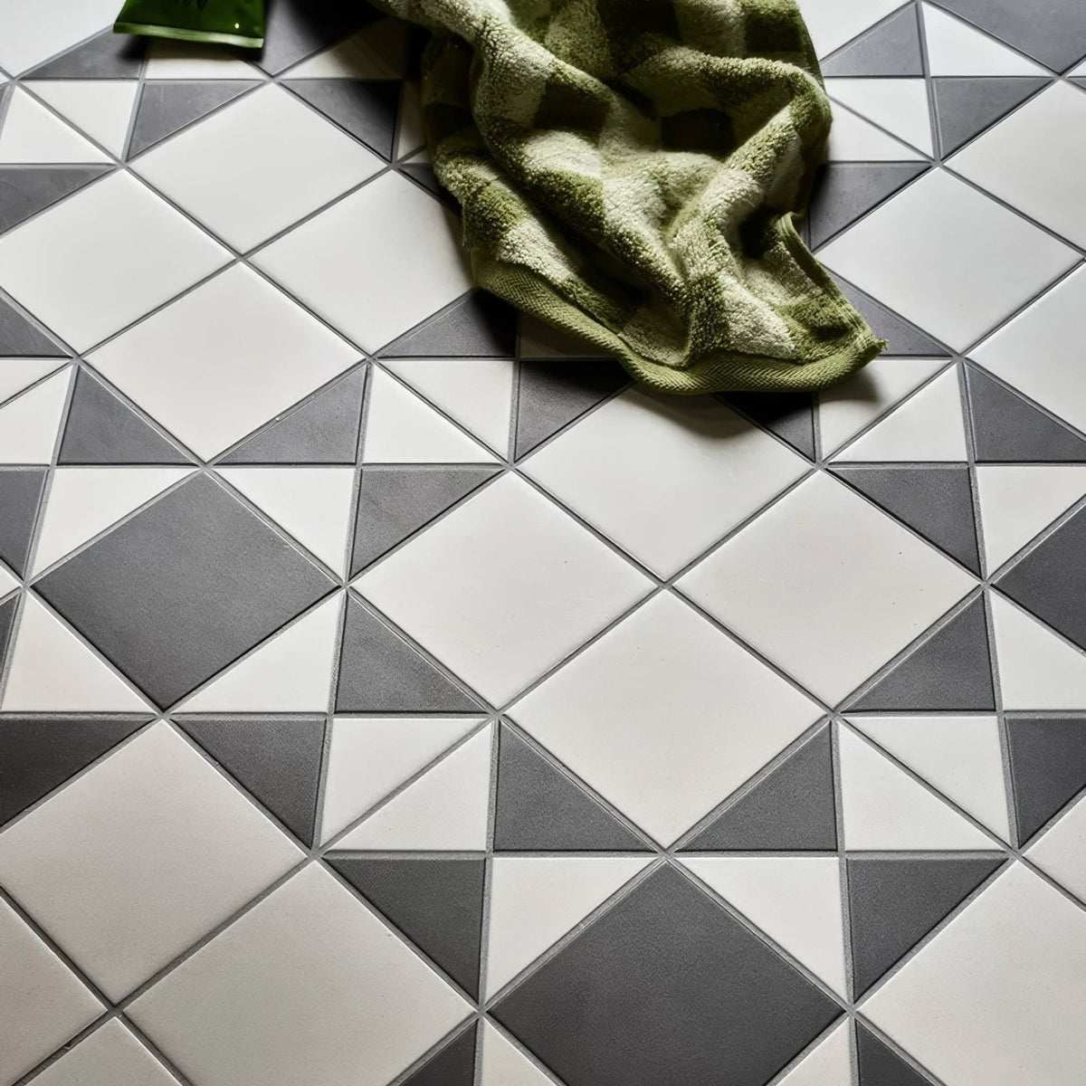 Victorian style porcelain tile floor in cotton white with geometric dark gray diamond pattern finchley design