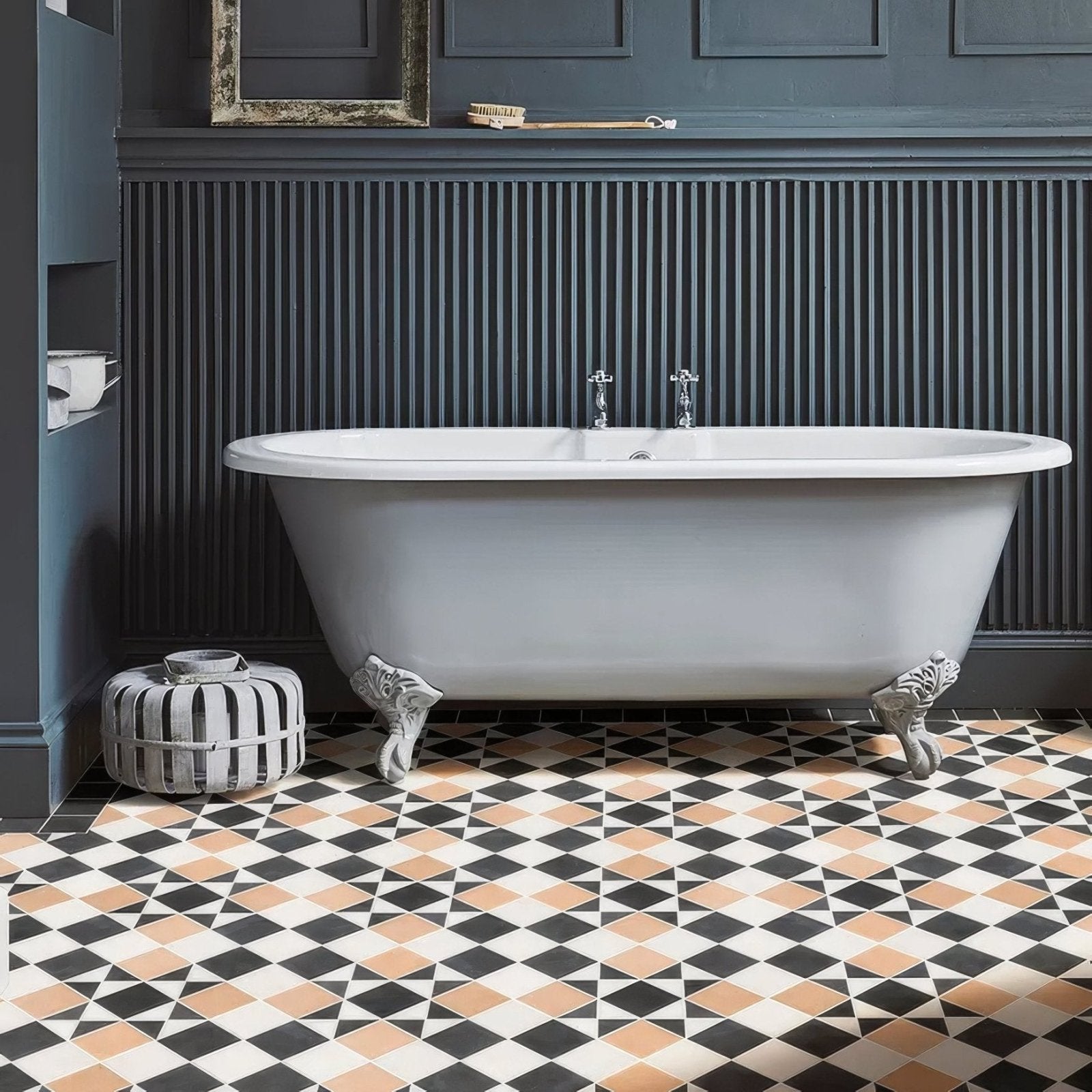 White enamel clawfoot bathtub with chrome fixtures in victorian style porcelain finchley pattern sandstone