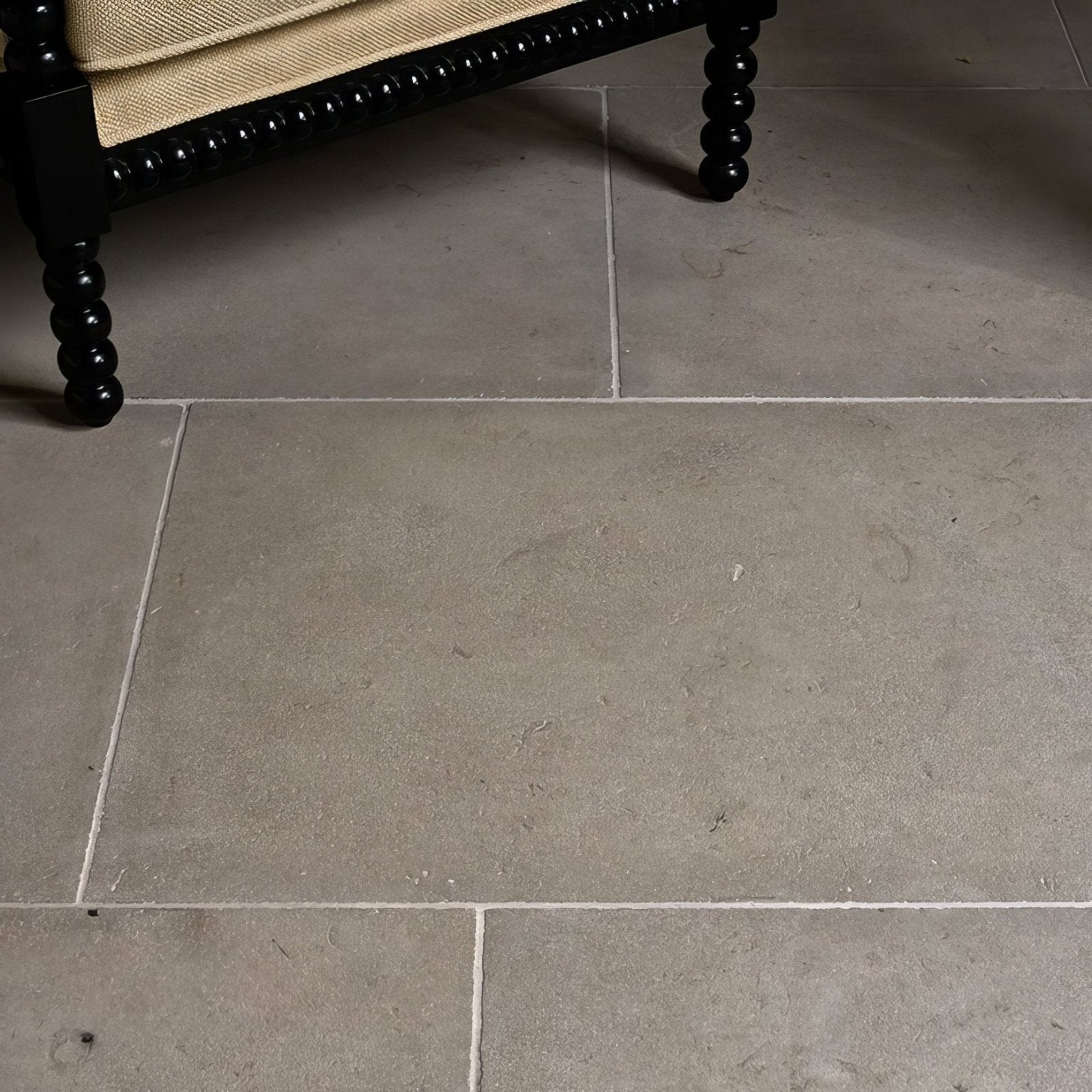 Gray vienne limestone satino floor tiles with subtle texture and natural color variations for elegant flooring