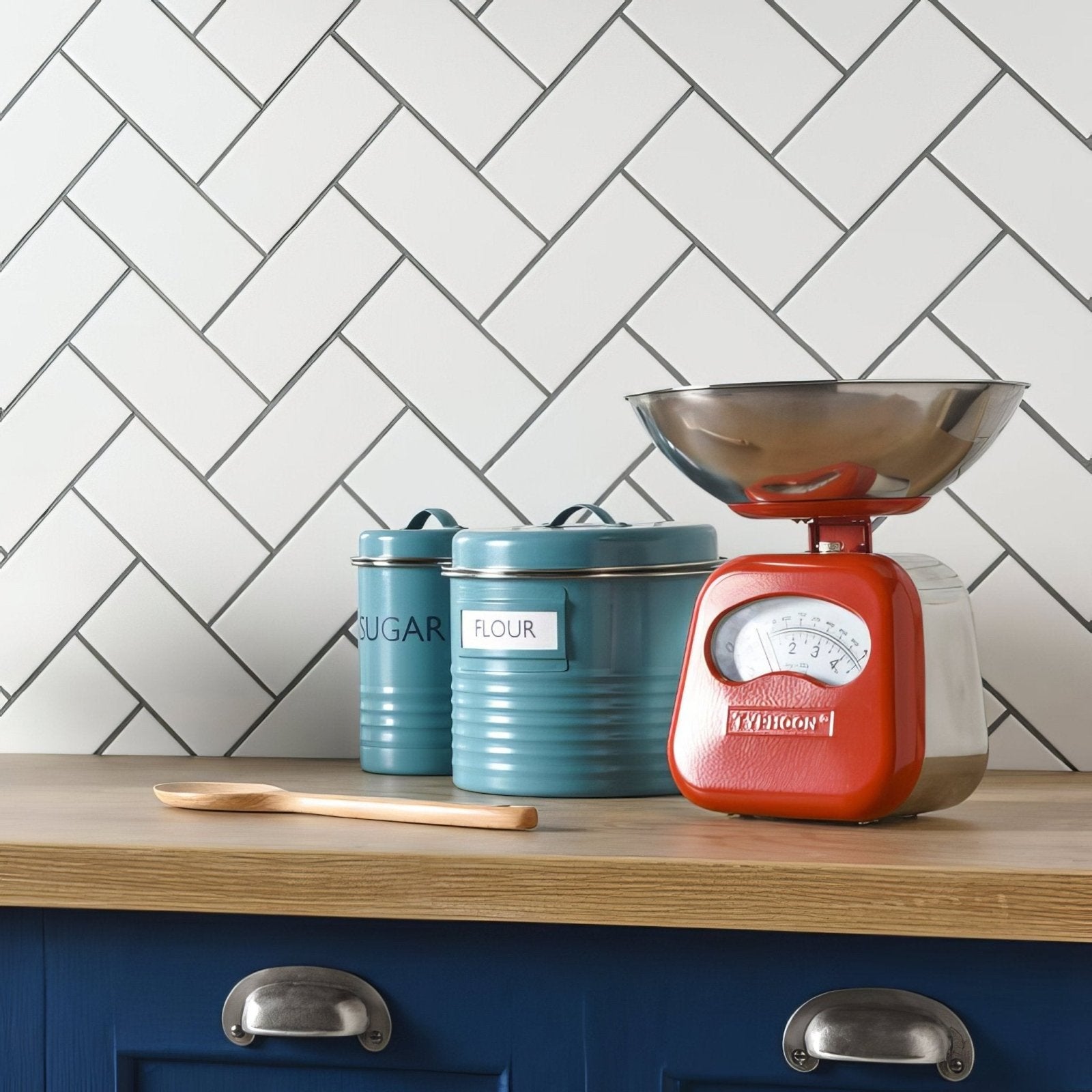 Red vintage-style kitchen scale with stainless steel bowl and analog dial on vintage white half tile background
