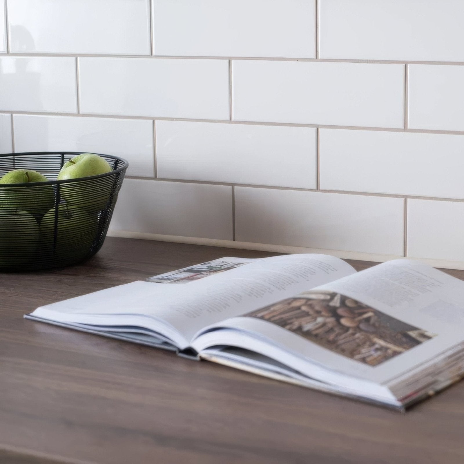 Open vintage white large brick book with white pages and black and white photo on wooden surface