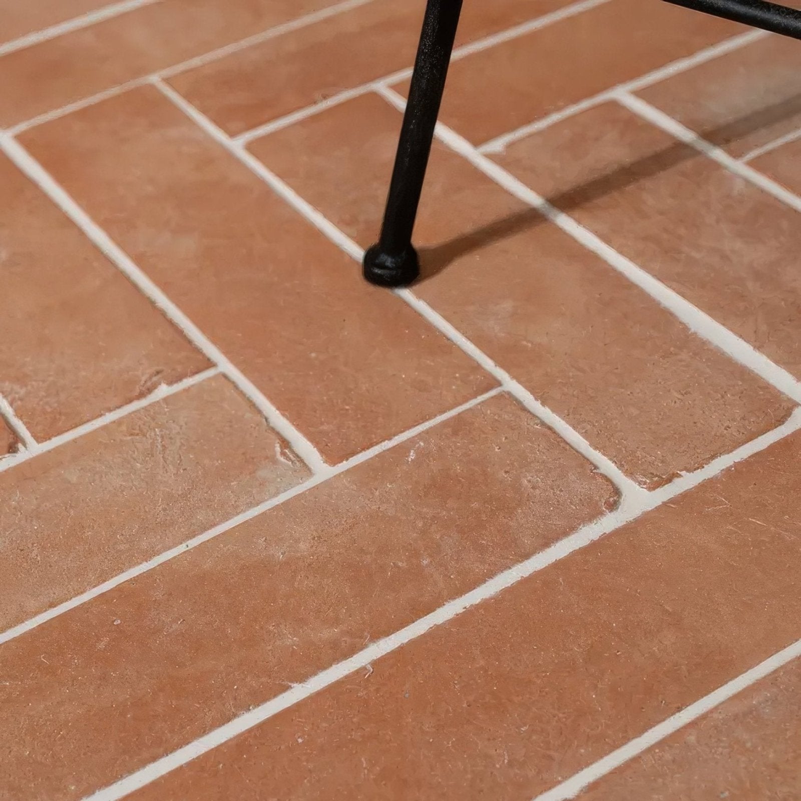 Wansdyke external terracotta rectangular tiles in terracotta color with white grout lines arranged in a staggered pattern