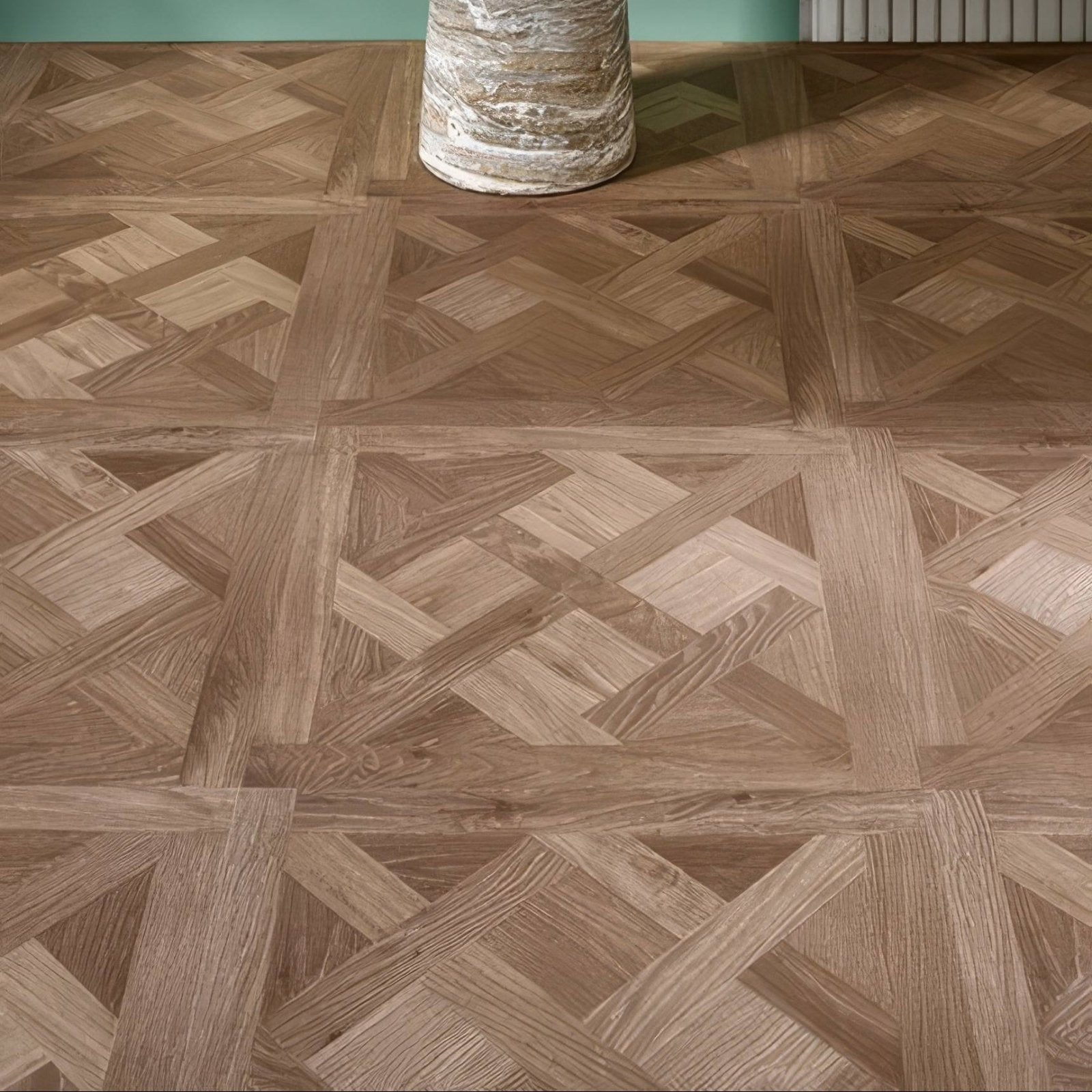 Brown wood-effect parquet floor tiles in herringbone pattern from warwick emrys oak design panel