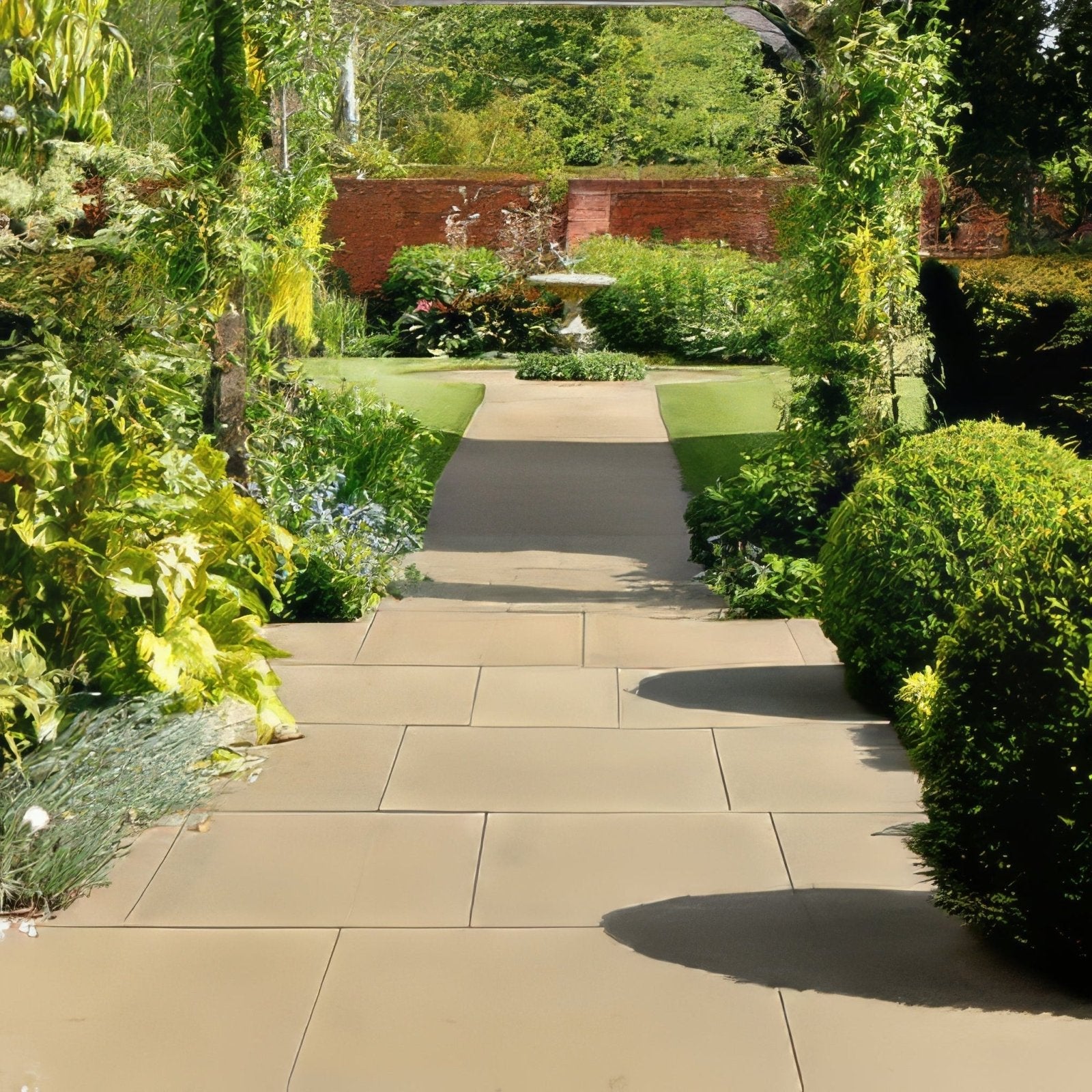 Beige wensley york sandstone honed stone pathway leading through a lush garden area