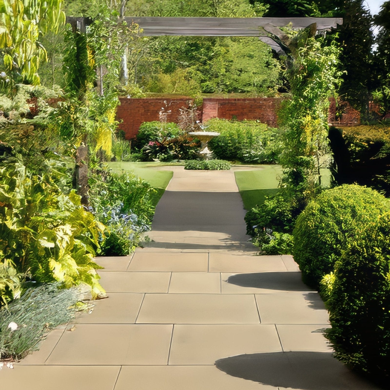 A serene garden pathway paved with wensley york sandstone honed smooth light beige slabs leading to a fountain