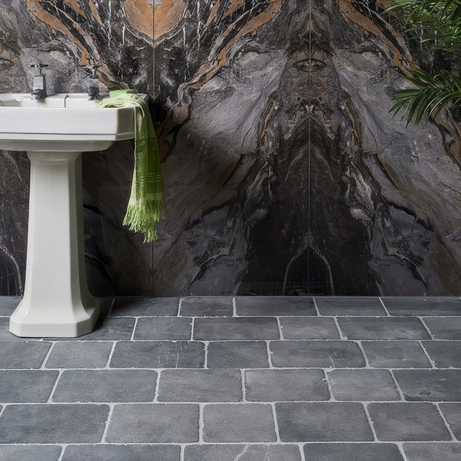 White pedestal sink with sleek modern design and smooth ceramic finish in wexford limestone cobble tumbled finish