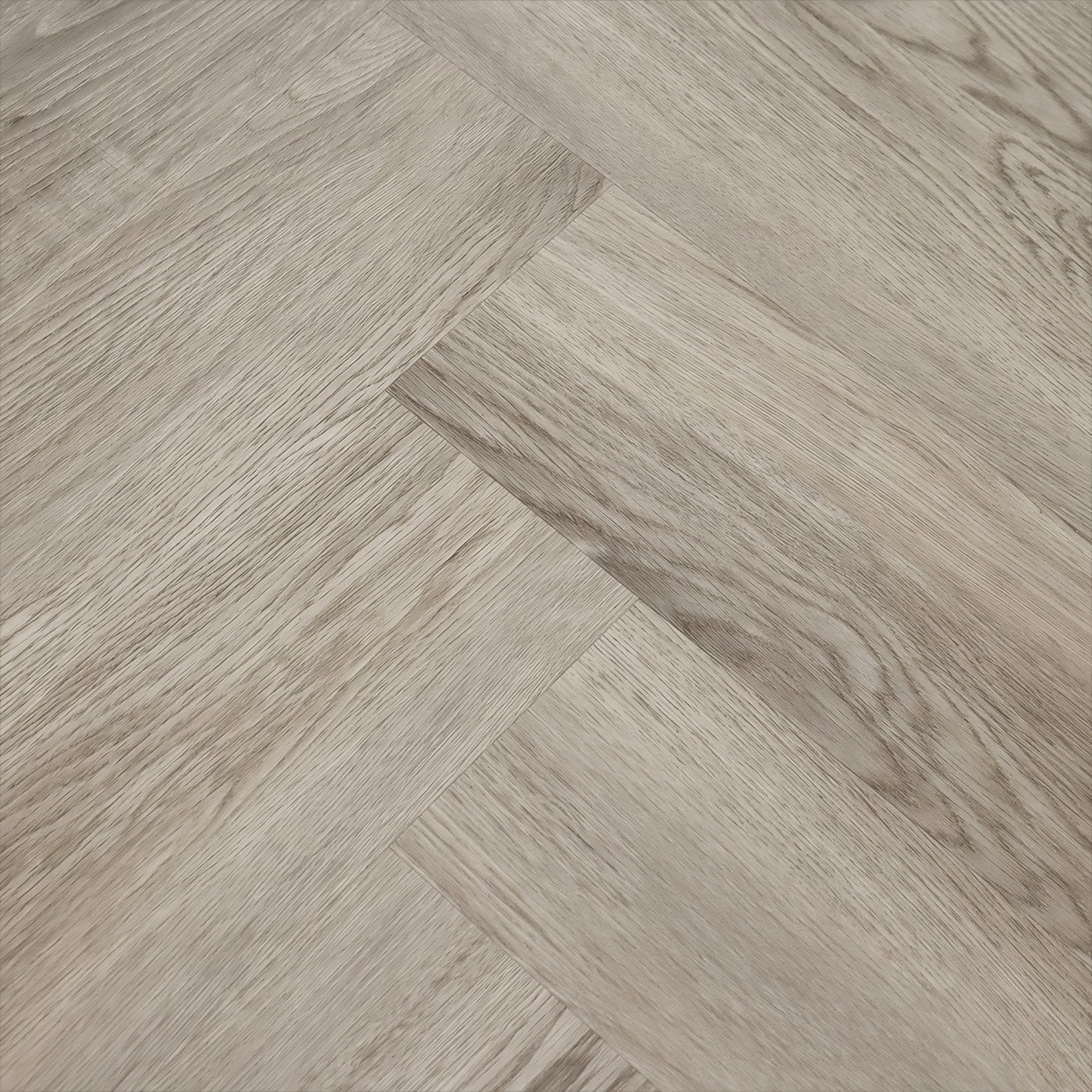 Grayish wood-effect Weymouth Alaskan Oak herringbone flooring planks with a textured oak pattern