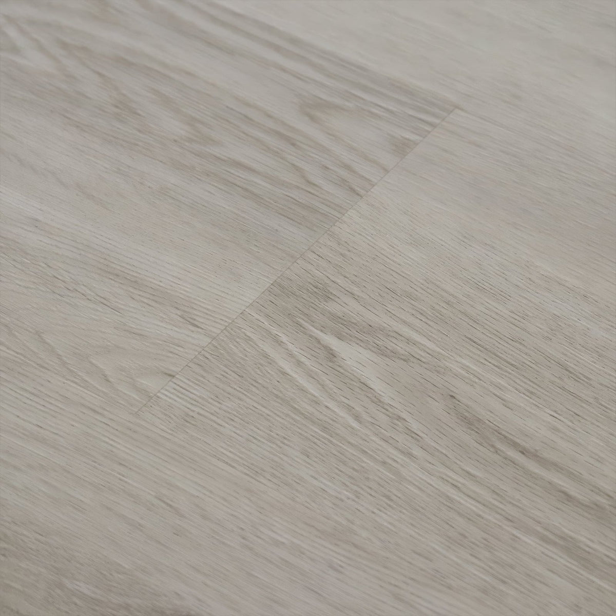 Light gray wood-grain vinyl plank flooring with subtle natural texture in weymouth seamist oak finish