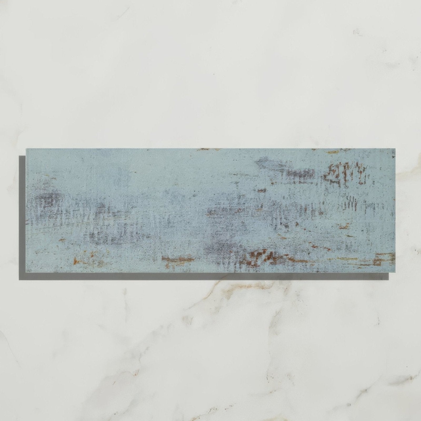 A rectangular distressed light blue wooden plank with visible wood grain and chipped paint for wightwick ceramic azure