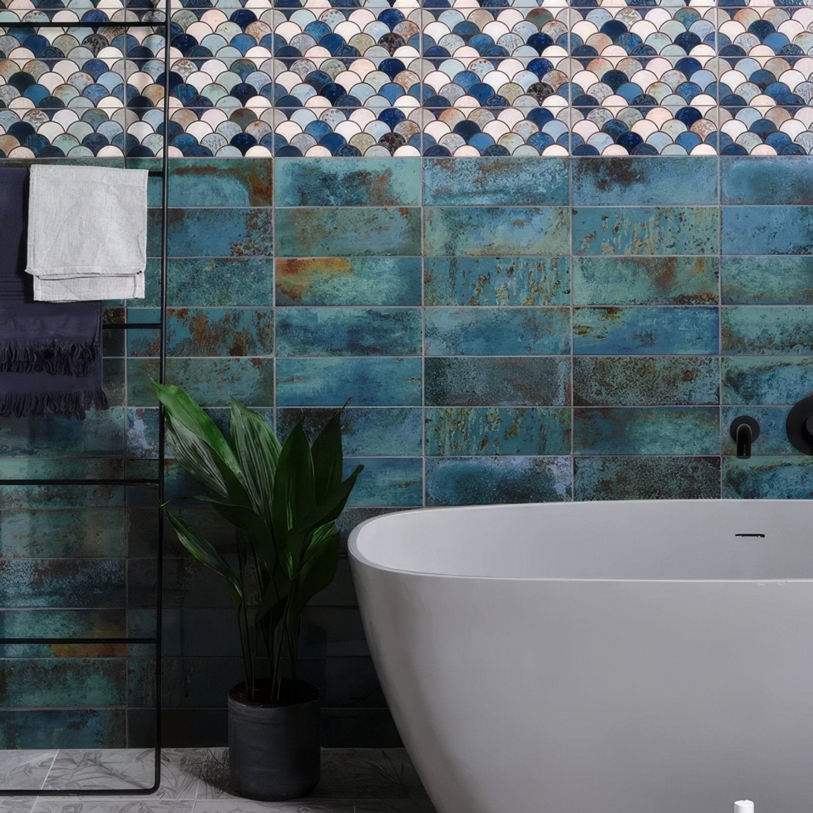 Wightwick ceramic emerald bathroom tiles feature teal and blue distressed scalloped and rectangular ceramic patterns above tub