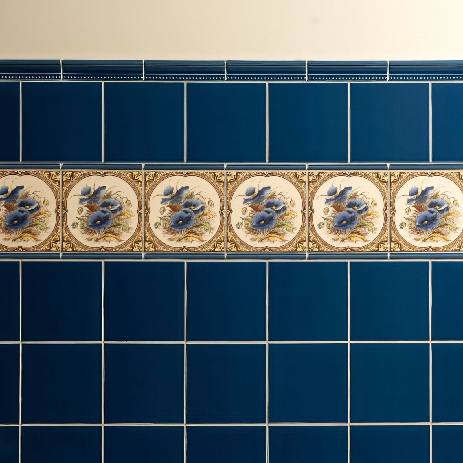 Windsor Blue Hogarth moulding ceramic tile strip with blue flower and bird motifs on cream background with gold detailing