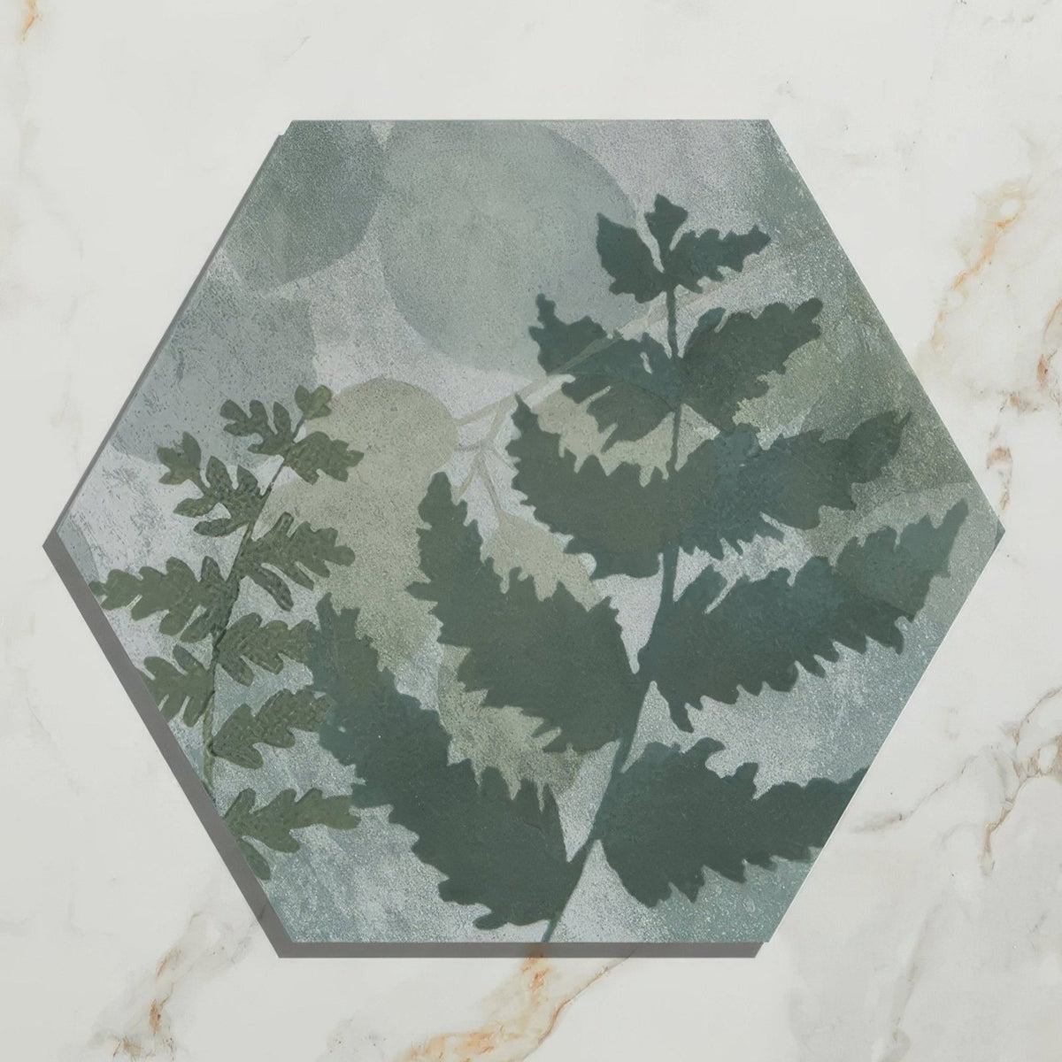 Hexagonal ceramic tile in muted green and gray with botanical fern design from woodland glade porcelain collection