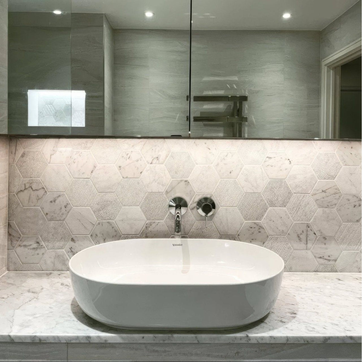 World Hexagon Tex White Mosaic white and grey hexagonal marble mosaic with a white oval vessel sink